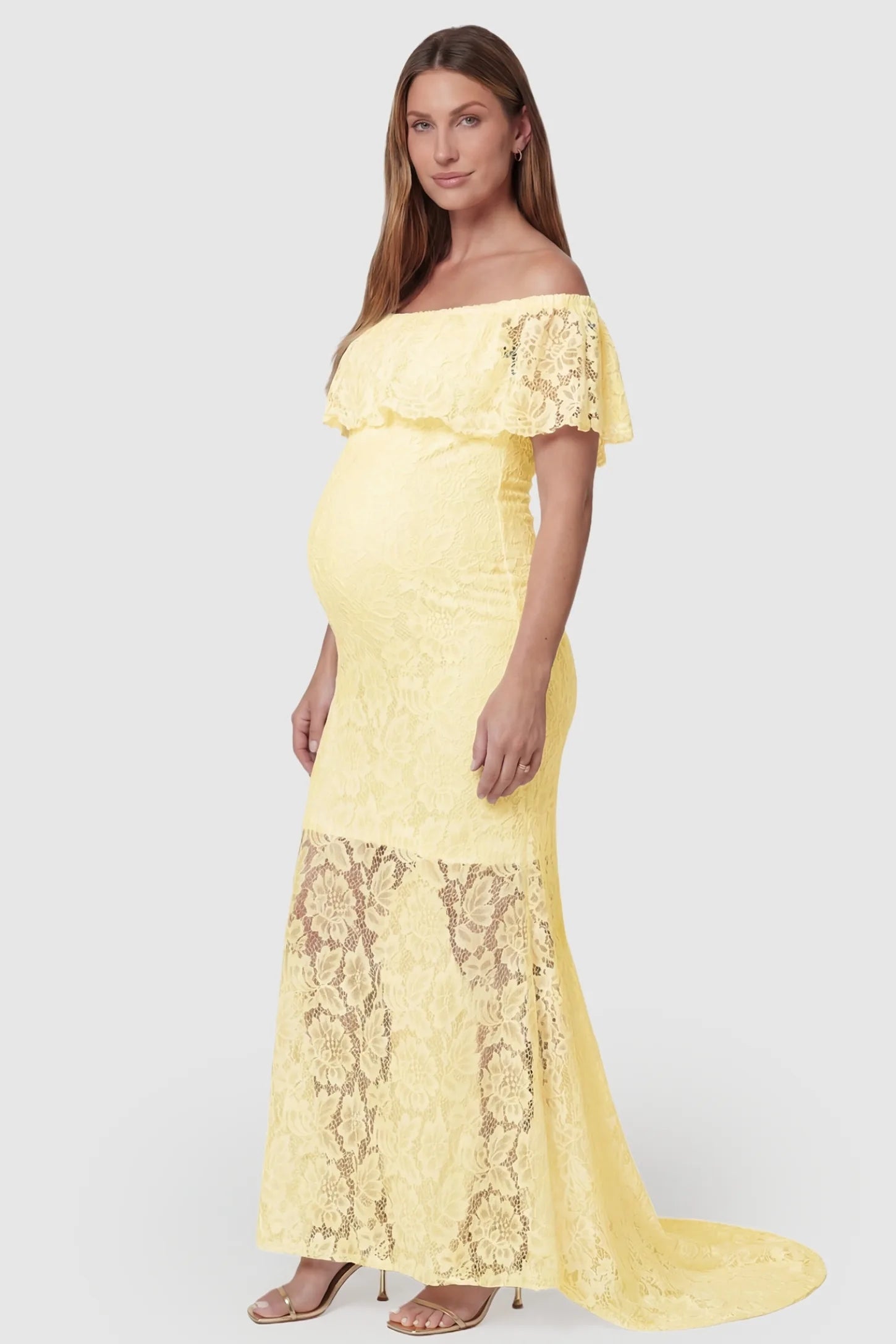 Lace Off-the-Shoulder Flutter Sleeve Maternity Maxi Dress Lace Off-the-Shoulder Flutter Sleeve Maternity Dress in Beige featuring an elegant side-profile view on a pregnant model.