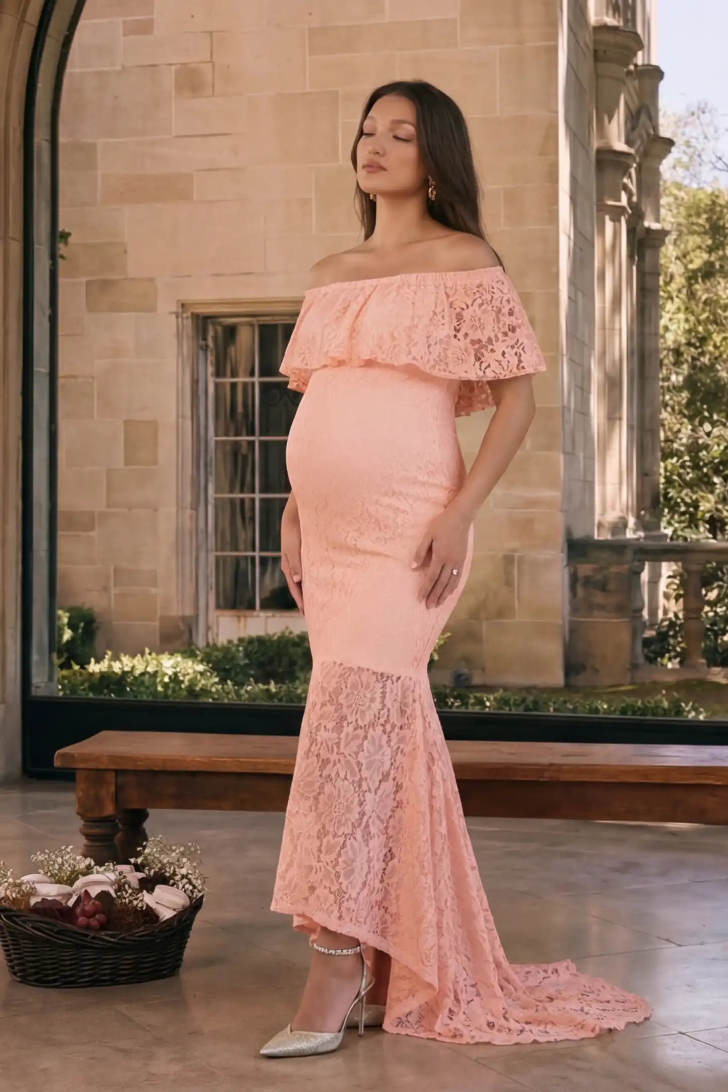 Lace Off-the-Shoulder Flutter Sleeve Maternity Maxi Dress Lace Off-the-Shoulder Flutter Sleeve Maternity Dress in Pink featuring a soft floral lace pattern on a pregnant model.