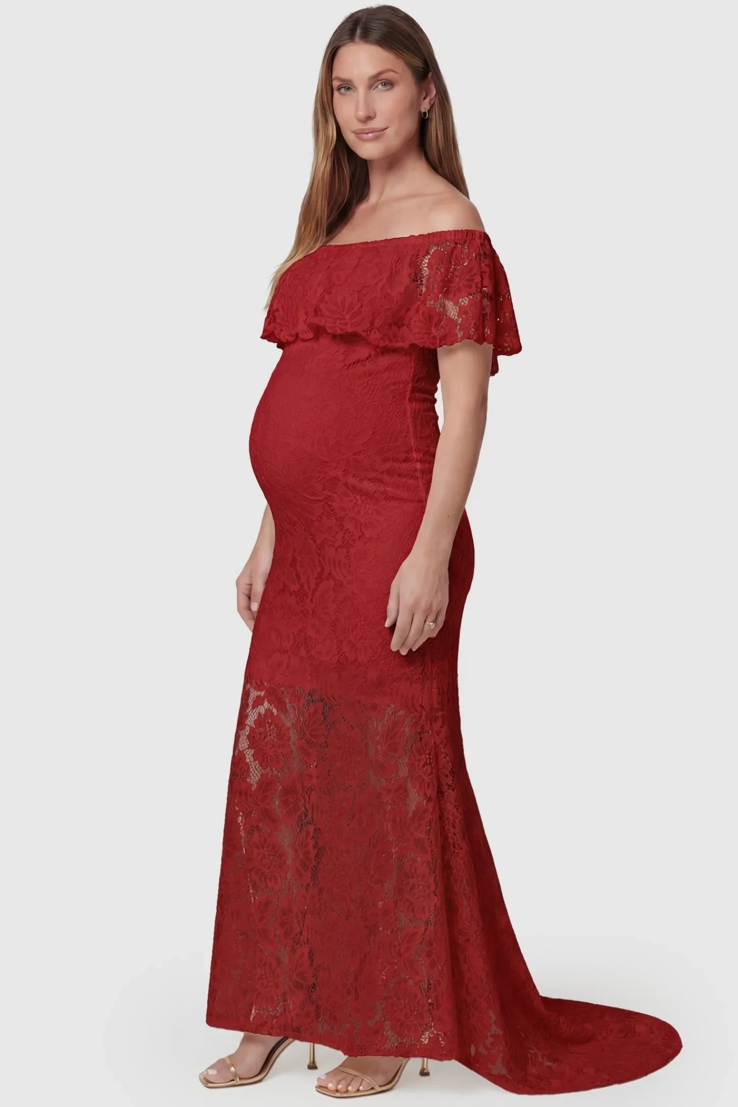 Lace Off-the-Shoulder Flutter Sleeve Maternity Maxi Dress Lace Off-the-Shoulder Flutter Sleeve Maternity Dress in Wine Red featuring a bump-hugging silhouette on a side-view pregnant model.