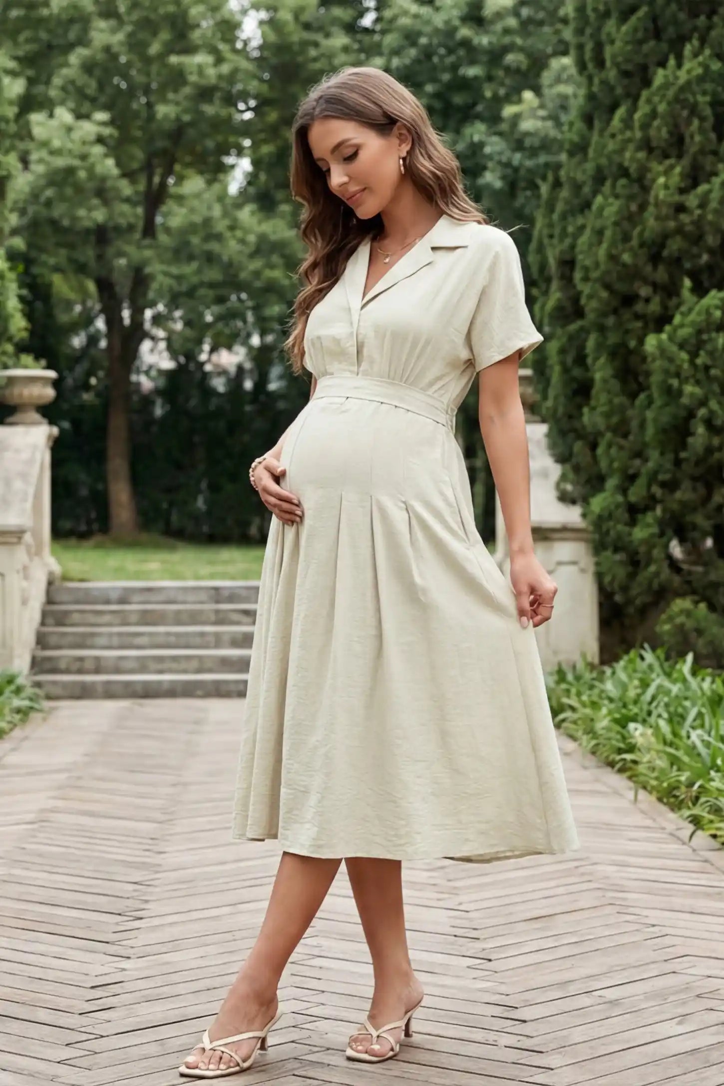 Lapel collar short sleeve A-line midi maternity dress in light green featuring high waisted silhouette in full body front view on a UGC model