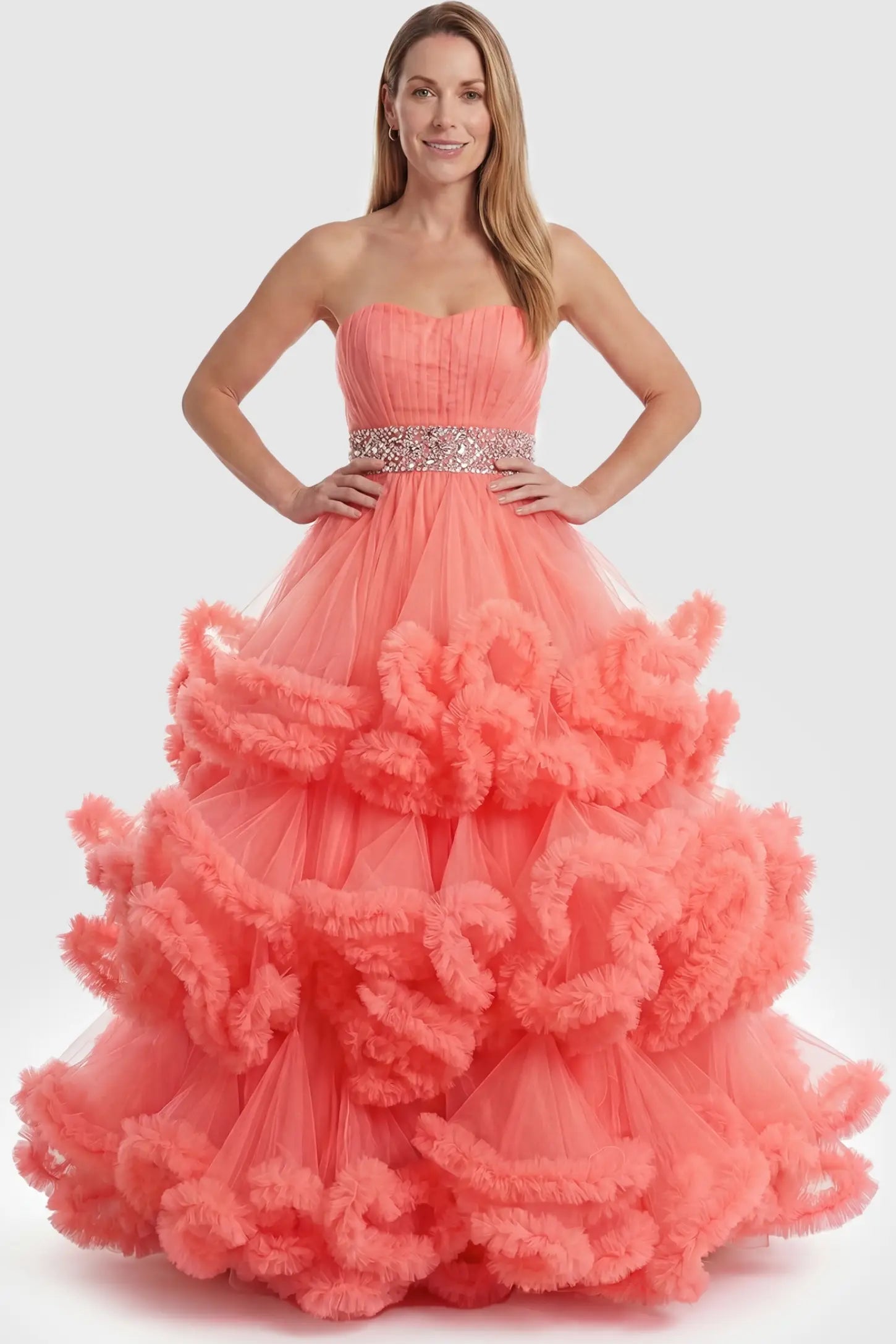 Multi-Layered Pleated Tulle Strapless Bodice Maxi Maternity Gown Multi-layered pleated tulle strapless bodice maxi maternity gown in orange featuring sleeveless layered pleated tulle skirt in full body view on a postpartum model