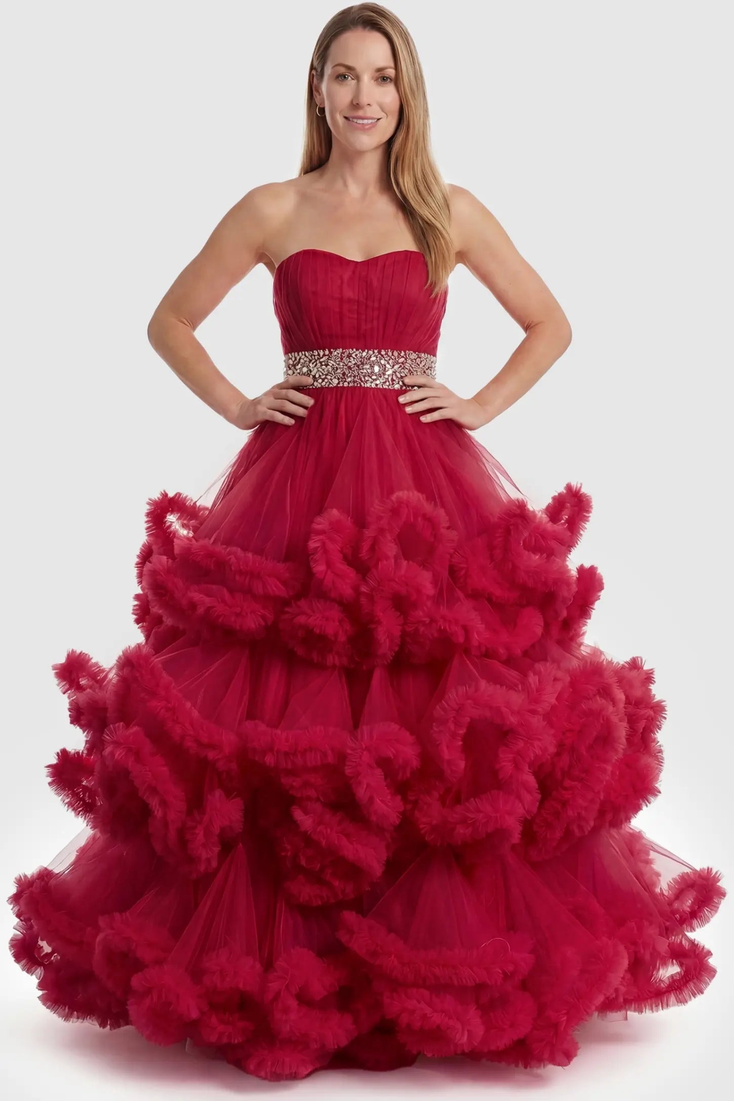 Multi-Layered Pleated Tulle Strapless Bodice Maxi Maternity Gown Multi-layered pleated tulle strapless bodice maxi maternity gown in red featuring sleeveless layered pleated tulle skirt in full body view on a postpartum model