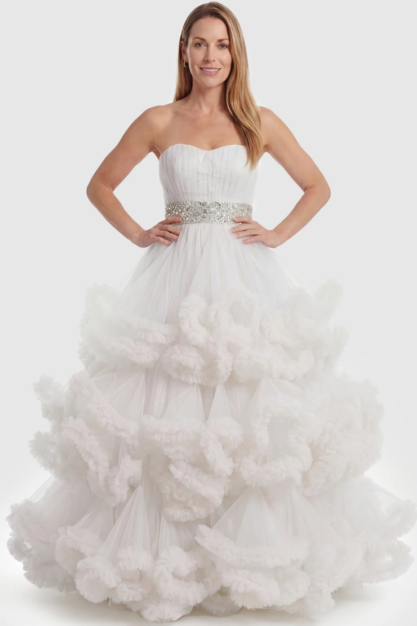 Multi-Layered Pleated Tulle Strapless Bodice Maxi Maternity Gown Multi-layered pleated tulle strapless bodice maxi maternity gown in white featuring sleeveless layered pleated tulle skirt in full body view on a postpartum model