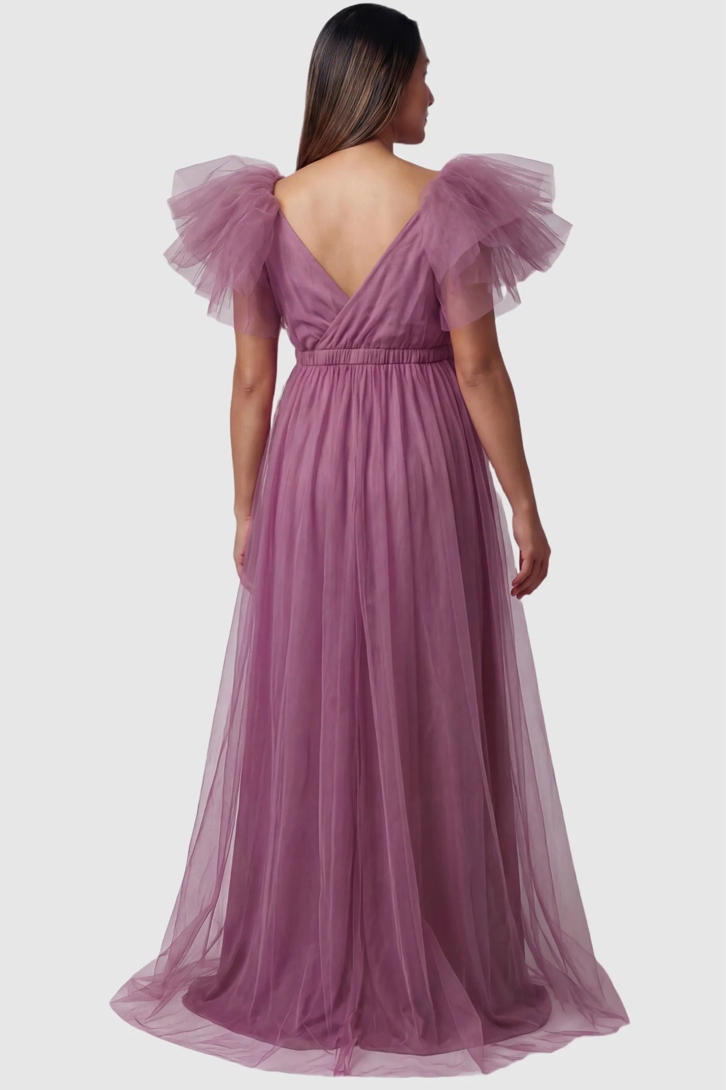 Layered Tulle Ruffle Sleeve Maternity Photoshoot Dress Layered Tulle Ruffle Sleeve Maternity Photoshoot Dress in Mauve featuring a back V-neckline on a pregnant model.