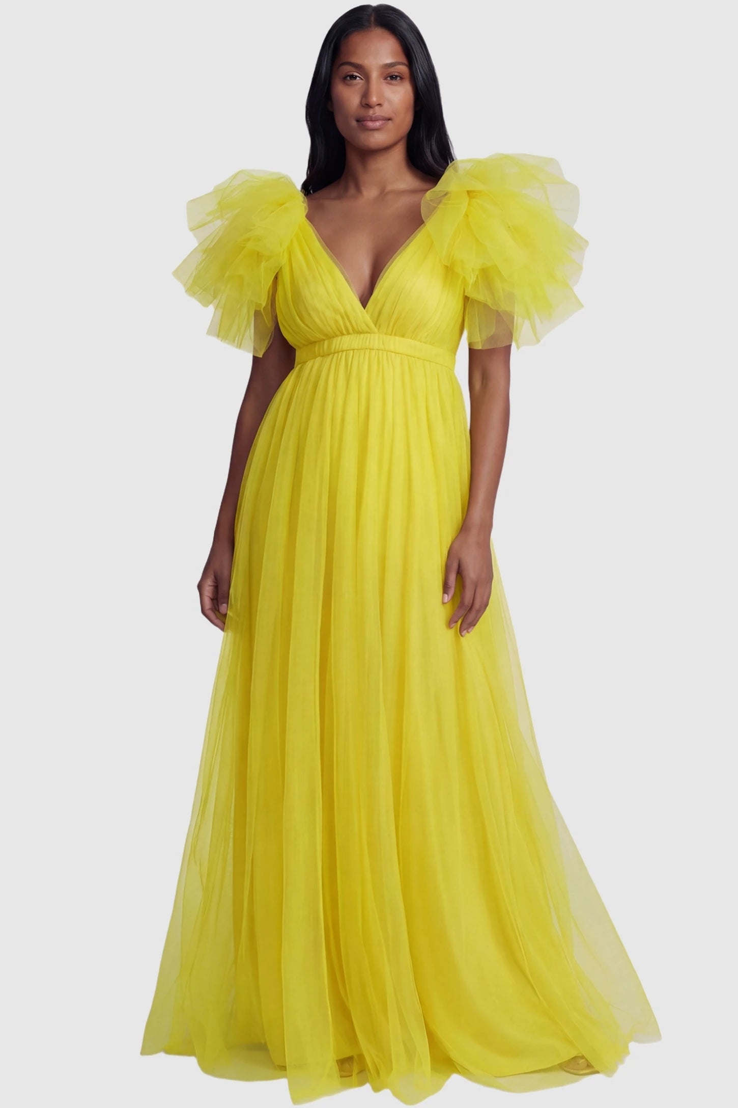 Layered Tulle Ruffle Sleeve Maternity Photoshoot Dress Layered Tulle Ruffle Sleeve Maternity Photoshoot Dress in Lemon Yellow featuring ruffled sleeves on a non-pregnant model.