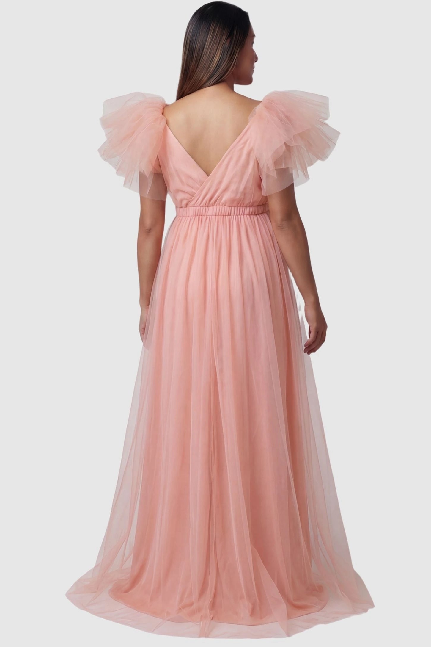 Layered Tulle Ruffle Sleeve Maternity Photoshoot Dress Layered Tulle Ruffle Sleeve Maternity Photoshoot Dress in Pink featuring a V-back design on a pregnant model.