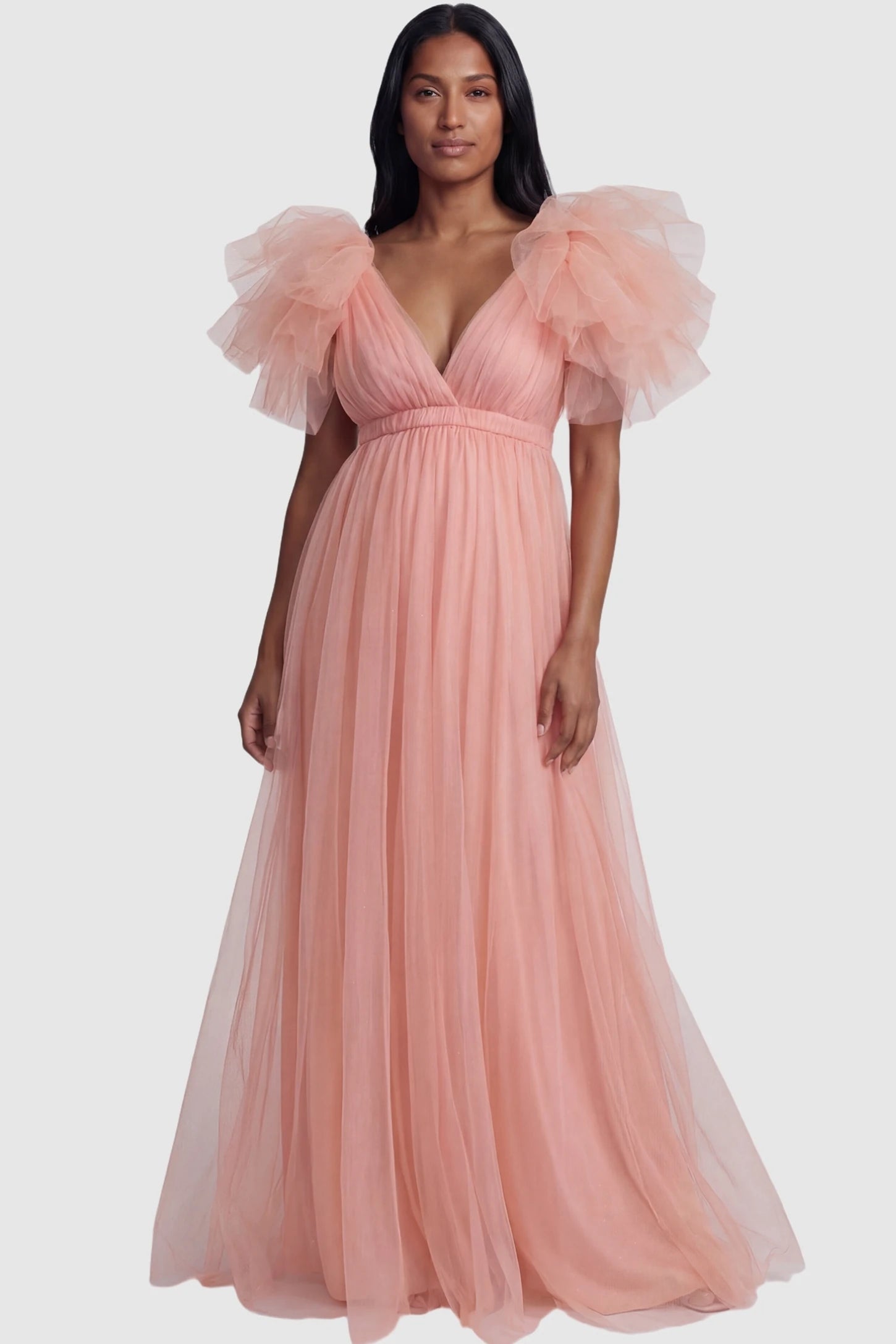 Layered Tulle Ruffle Sleeve Maternity Photoshoot Dress Layered Tulle Ruffle Sleeve Maternity Photoshoot Dress in Pink featuring a floor-length tulle skirt on a non-pregnant model.