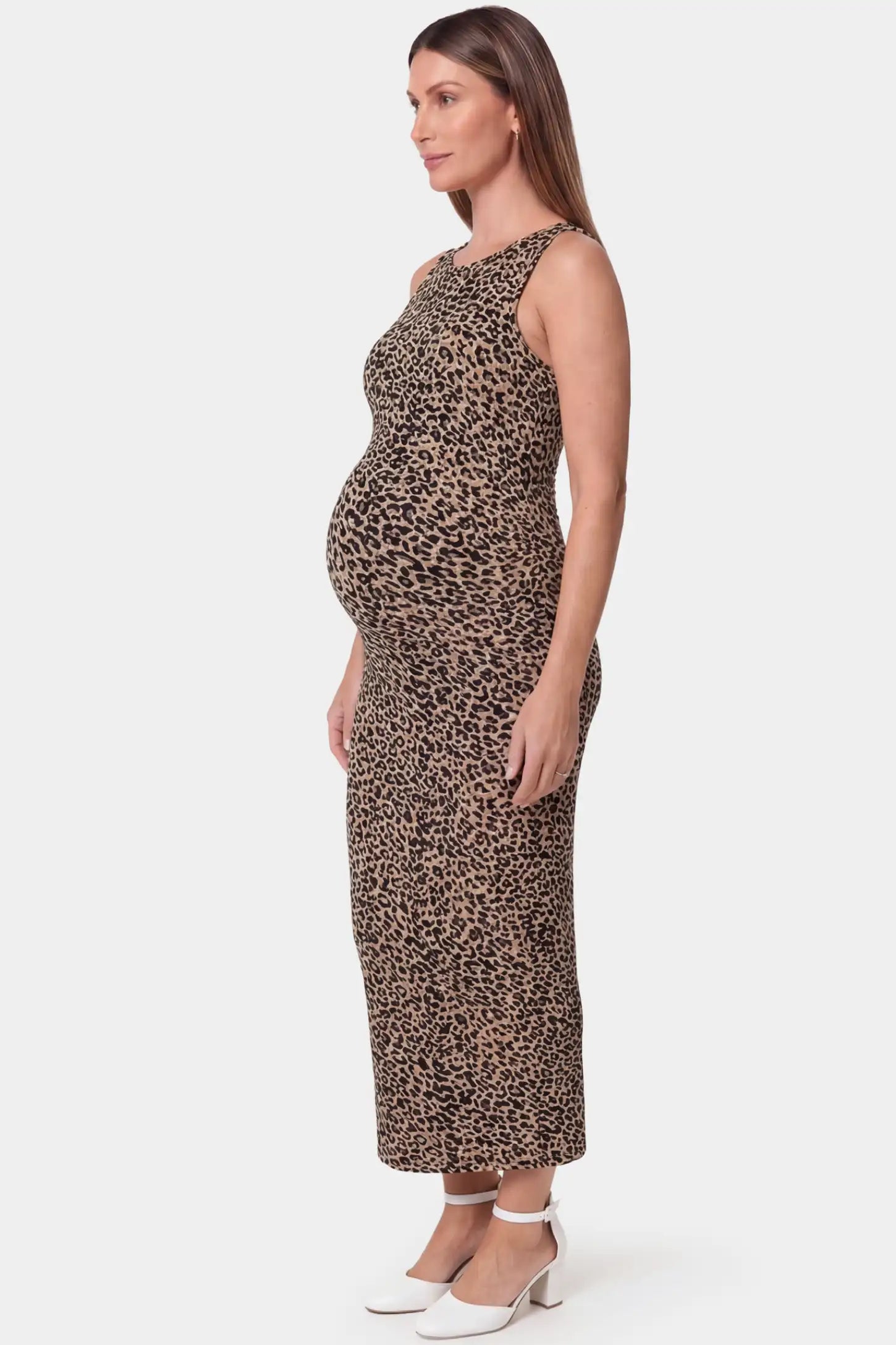 Leopard print sleeveless bodycon maxi maternity dress in dark colorways featuring sleek bodycon fit in side view on a pregnant model