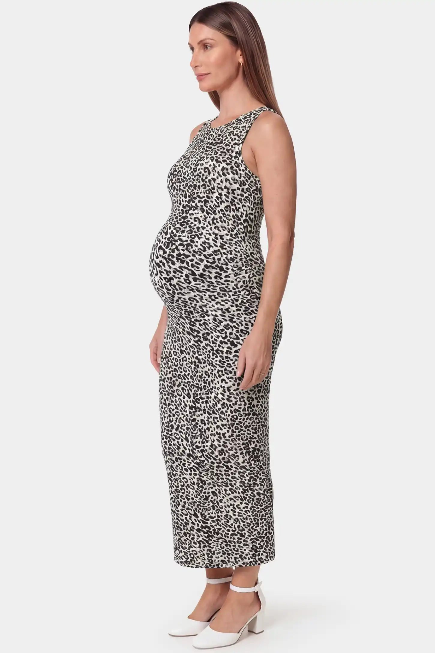 Leopard Print Sleeveless Bodycon Maxi Maternity Dress Leopard print sleeveless bodycon maxi maternity dress in light colorways featuring sleek bodycon fit in side view on a pregnant model