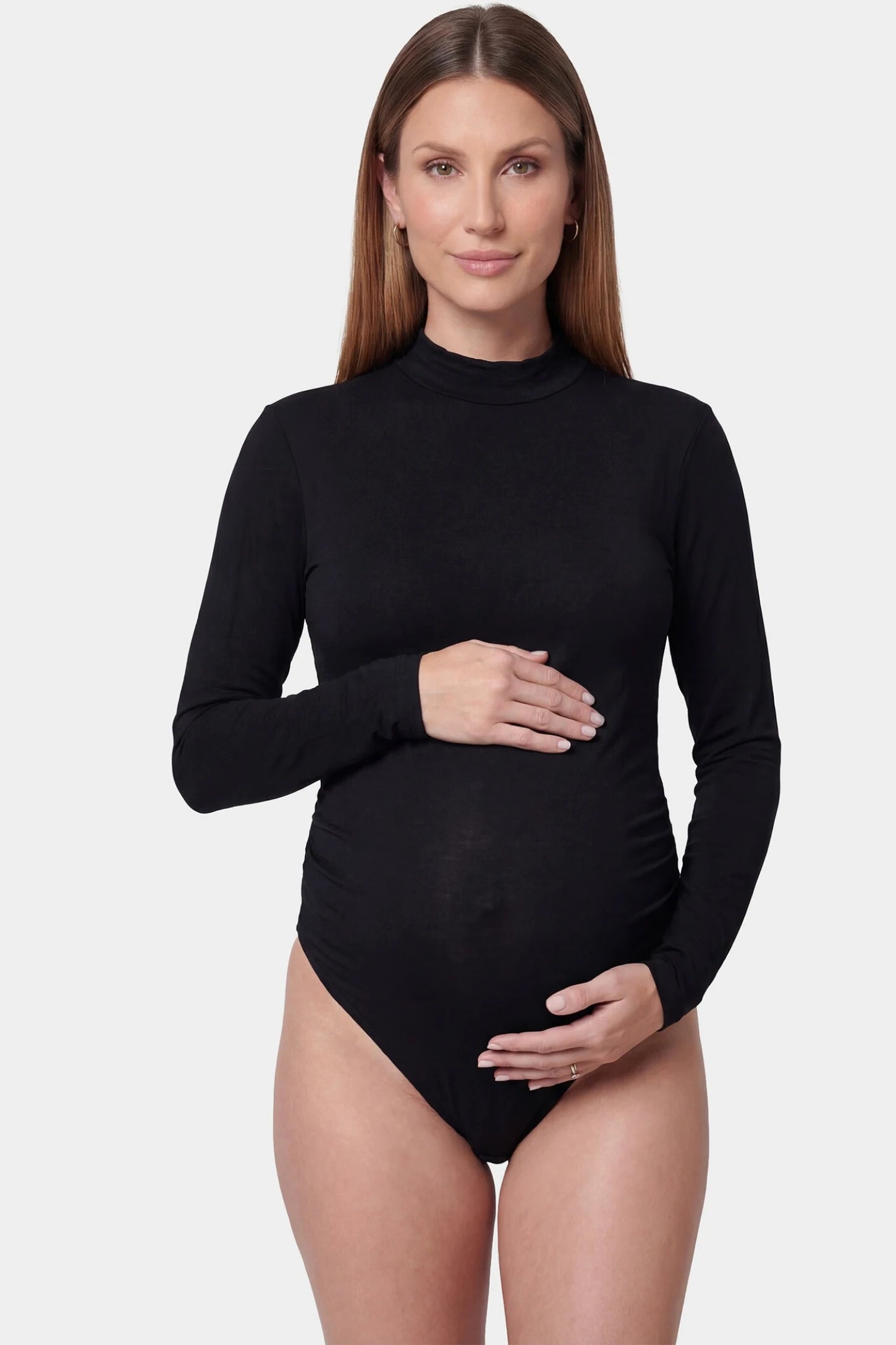 Sheer mesh long sleeve bodycon maternity photography bodysuit in black featuring high stretch fabric on a pregnant model