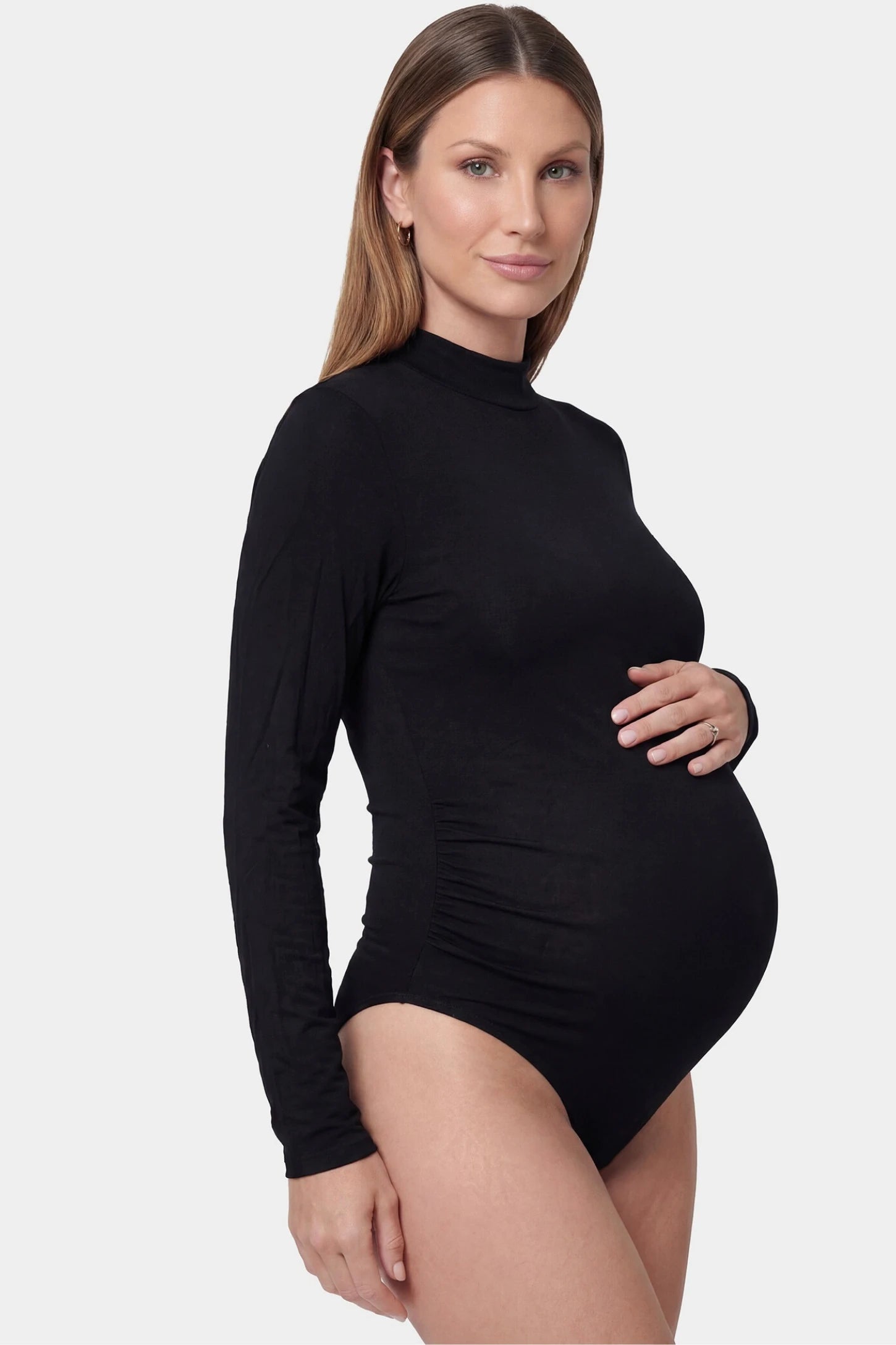 Sheer mesh long sleeve bodycon maternity photography bodysuit in black featuring high stretch fabric on a pregnant model