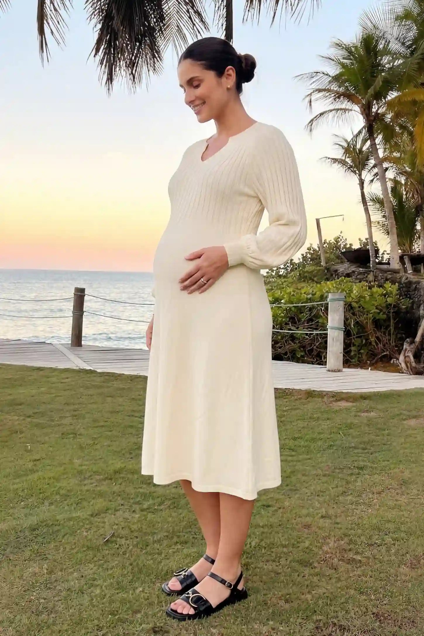 Notched Neck Long Sleeve Maternity Midi Dress Sweetheart neck long sleeve maternity midi dress in apricot with elegant long sleeves, side view on pregnant model