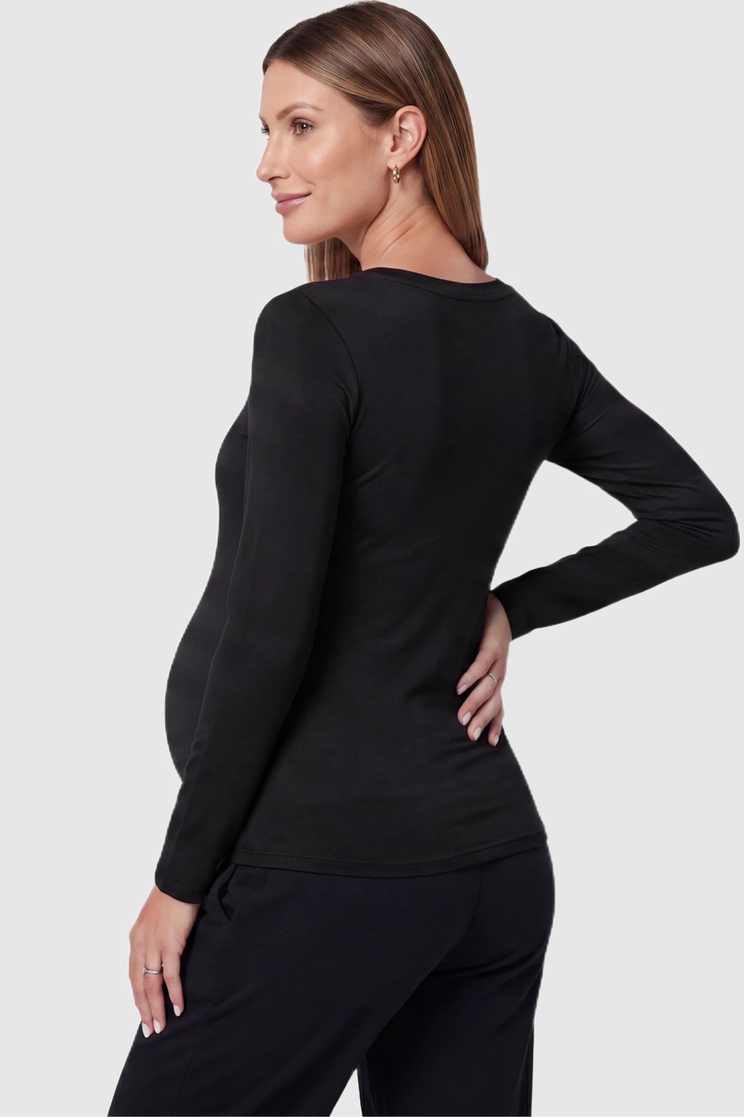 Soft Knit Long Sleeve V-Neck Maternity Top Soft knit long sleeve V-neck maternity top in black with long sleeves, back view on pregnant model