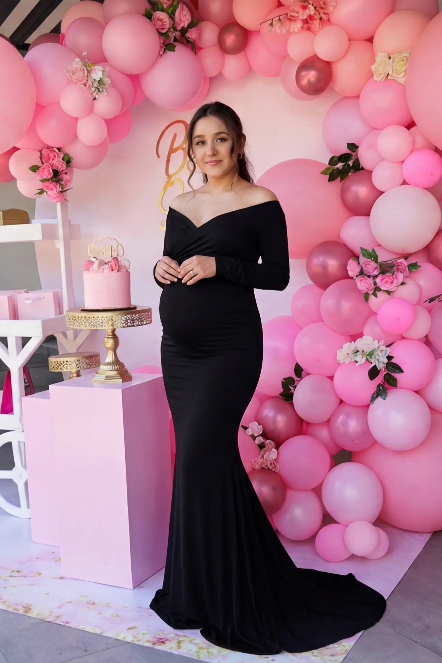 Off-Shoulder Long Sleeve Trailing Maxi Maternity Dress Off-shoulder long sleeve trailing maxi maternity dress in black with glamorous styling, editorial lifestyle model