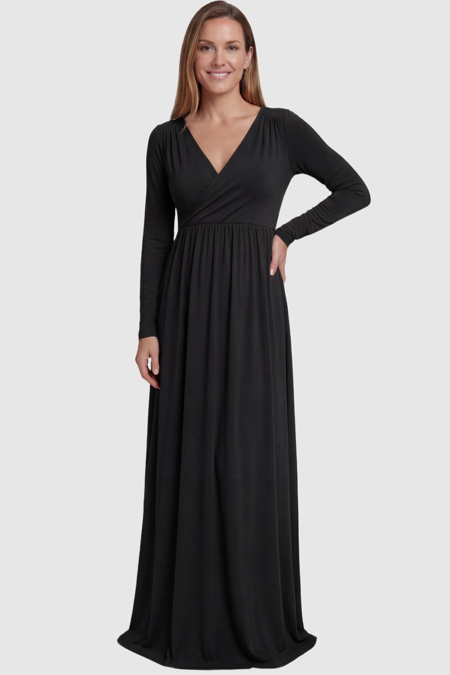 Off-Shoulder Long Sleeve Trailing Maxi Maternity Dress Off-shoulder long sleeve trailing maxi maternity dress in black featuring dramatic full train and elegant long sleeves in full body view on a postpartum model