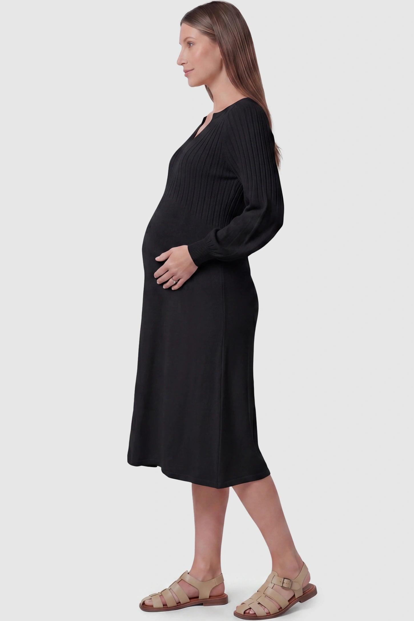 Notched Neck Long Sleeve Maternity Midi Dress Sweetheart neck long sleeve maternity midi dress in black with elegant long sleeves, side view on pregnant model