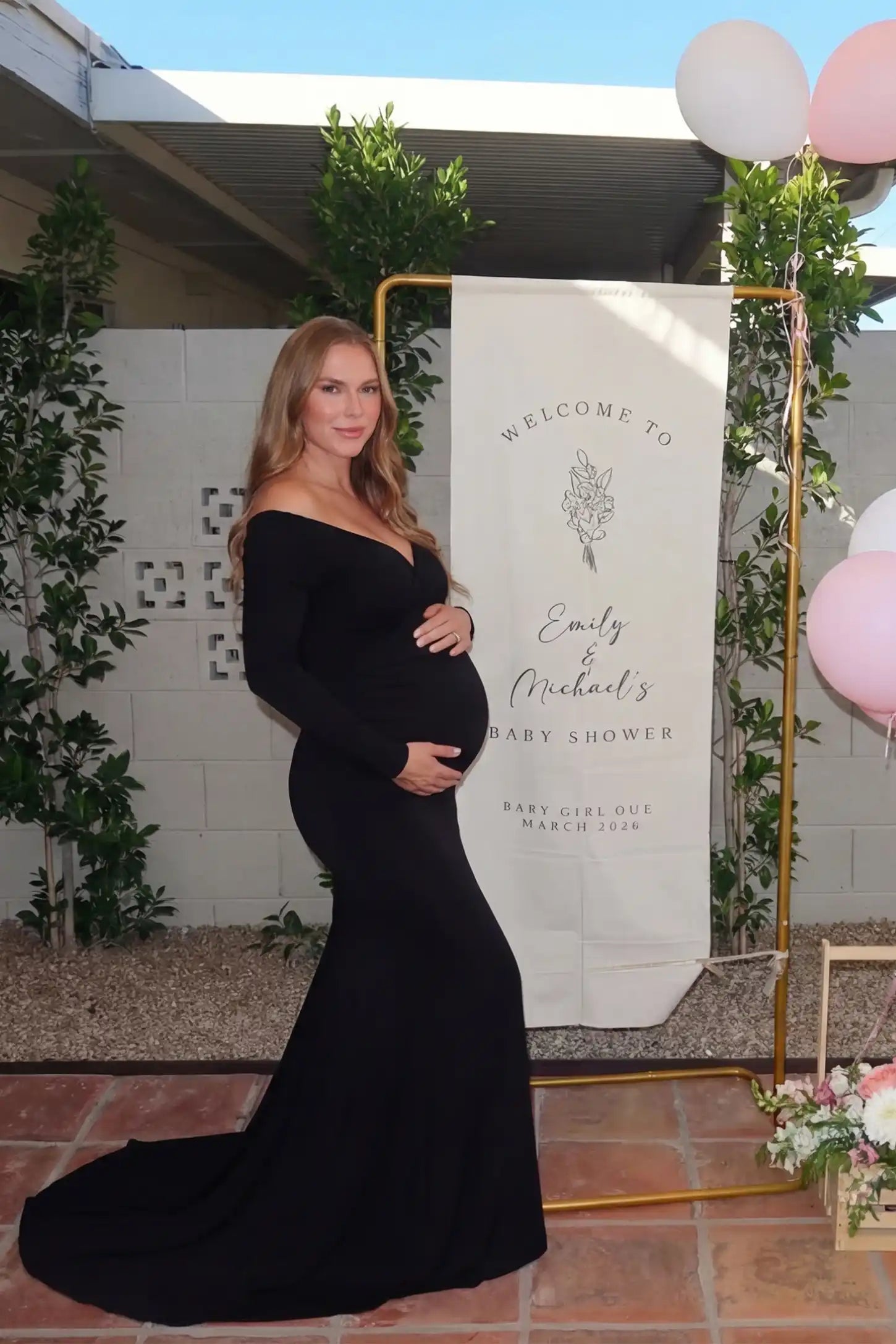 Off-Shoulder Long Sleeve Trailing Maxi Maternity Dress Off-shoulder long sleeve trailing maxi maternity dress in black with elegant silhouette, lifestyle UGC model