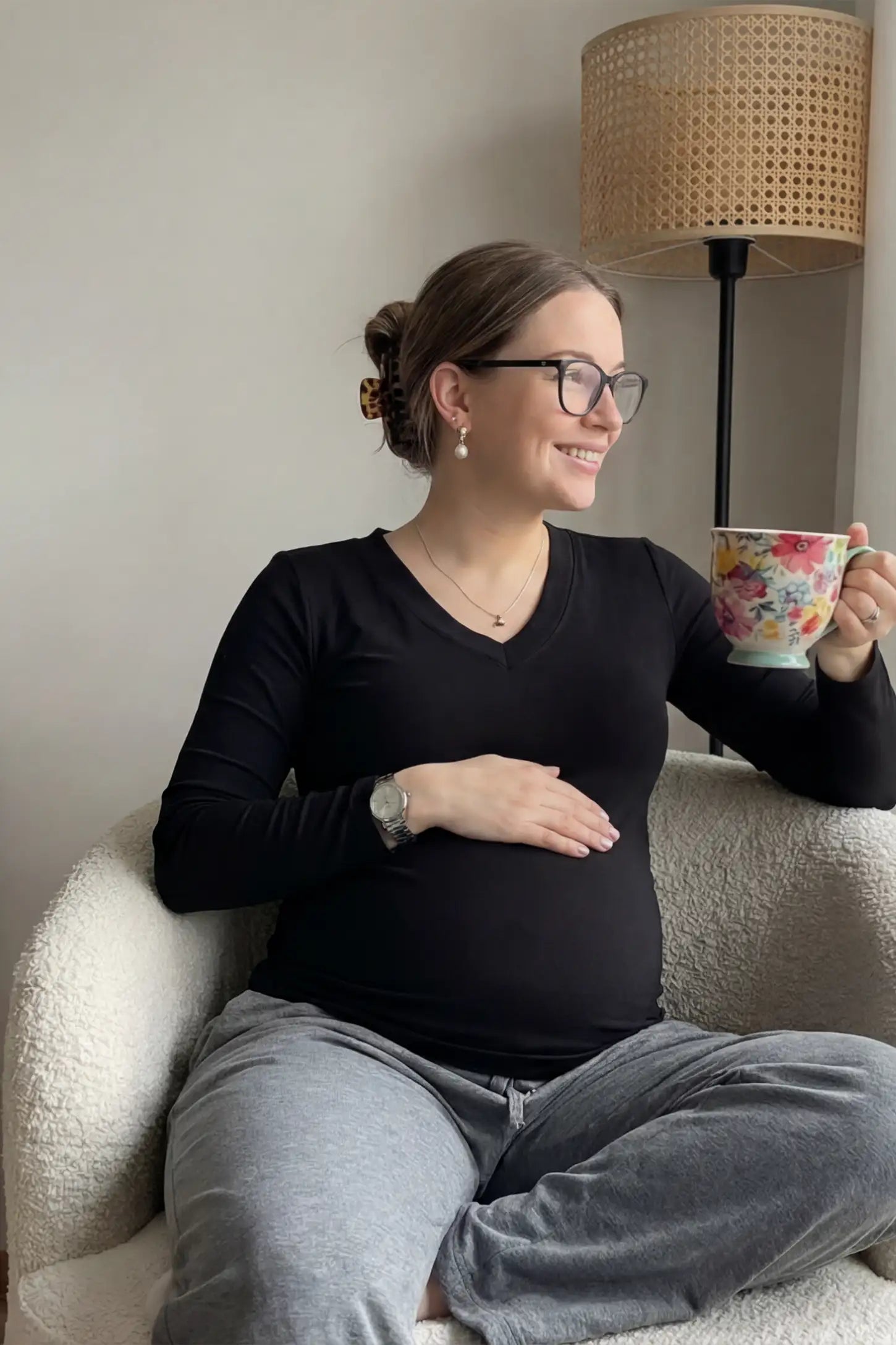 Soft Knit Long Sleeve V-Neck Maternity Top Soft knit long sleeve V-neck maternity top in black with flattering V-neckline and long sleeves, front view on pregnant model