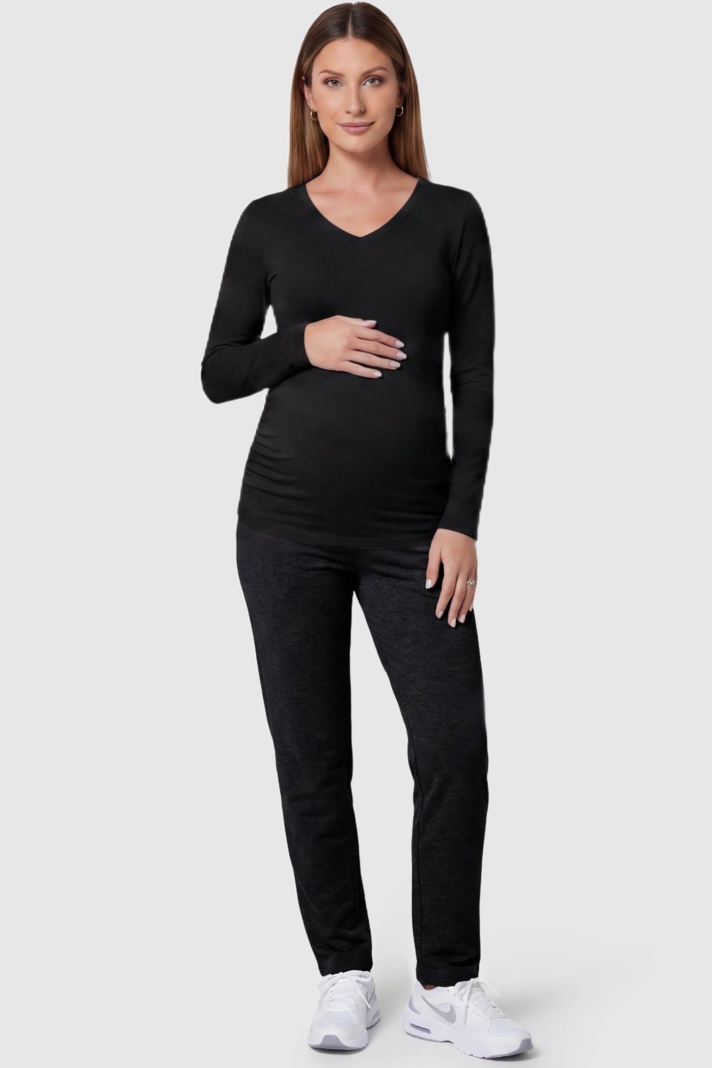 Soft Knit Long Sleeve V-Neck Maternity Top Soft knit long sleeve V-neck maternity top in black with flattering V-neckline and long sleeves, front view on pregnant model