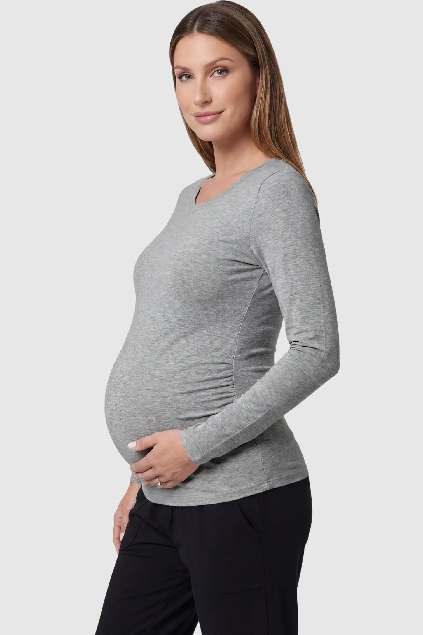 Soft Knit Long Sleeve V-Neck Maternity Top Soft knit long sleeve V-neck maternity top in gray with flattering V-neckline and long sleeves, side view on pregnant model