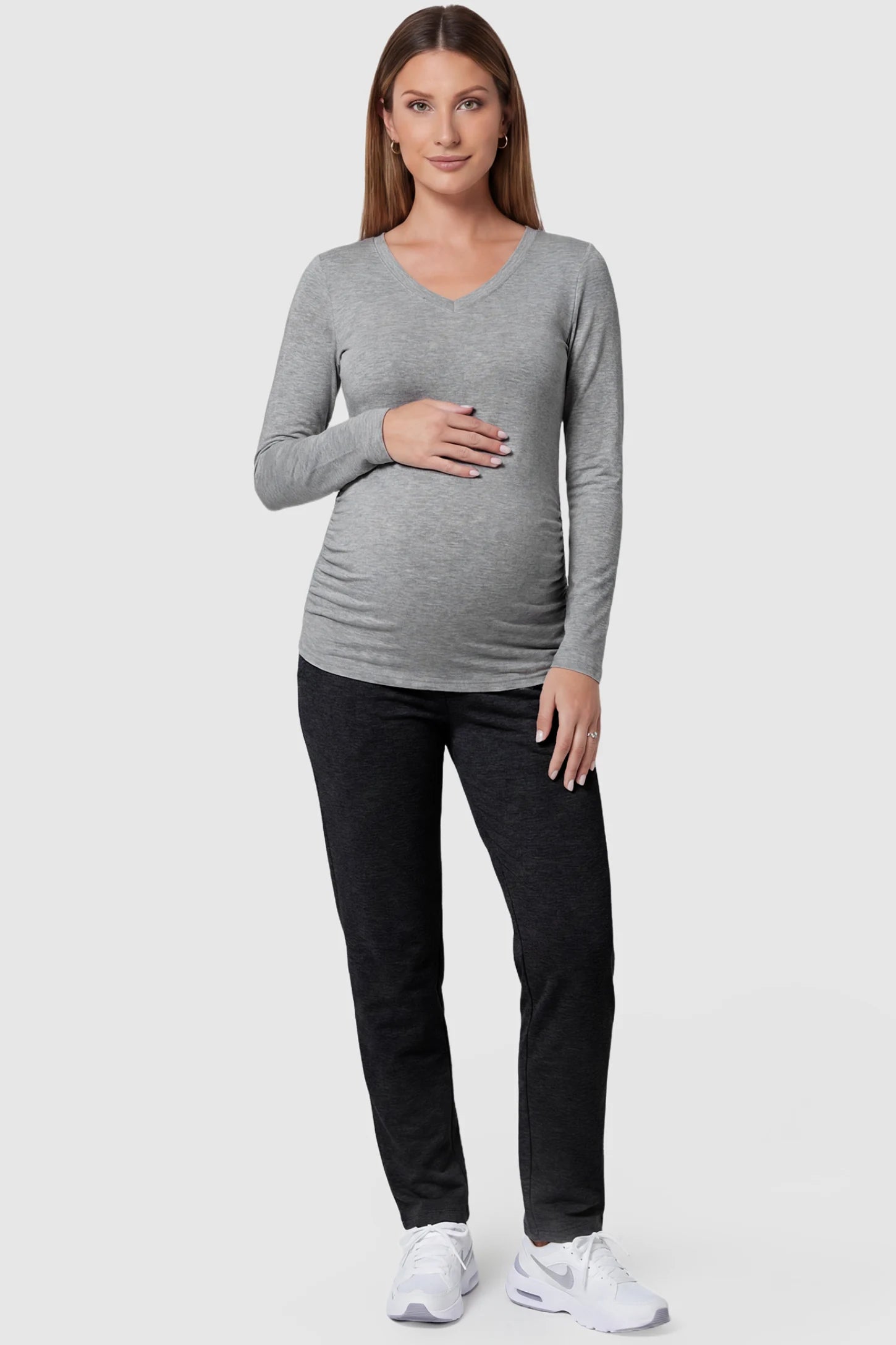 Soft Knit Long Sleeve V-Neck Maternity Top Soft knit long sleeve V-neck maternity top in gray with flattering V-neckline and long sleeves, front view on pregnant model