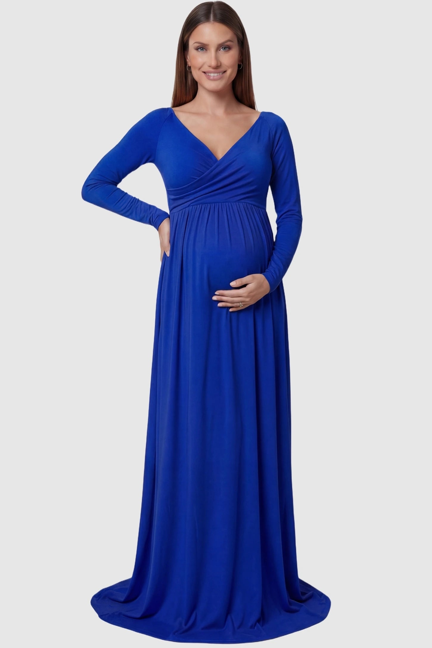 Off-Shoulder Long Sleeve Trailing Maxi Maternity Dress Off-shoulder long sleeve trailing maxi maternity dress in light blue featuring an elegant long sleeve silhouette in front view on a pregnant model