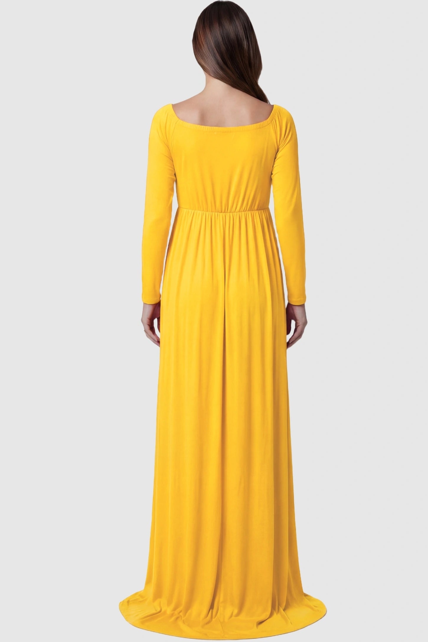 Off-Shoulder Long Sleeve Trailing Maxi Maternity Dress Off-shoulder long sleeve trailing maxi maternity dress in mustard yellow featuring flowing extended train in back view on a pregnant model