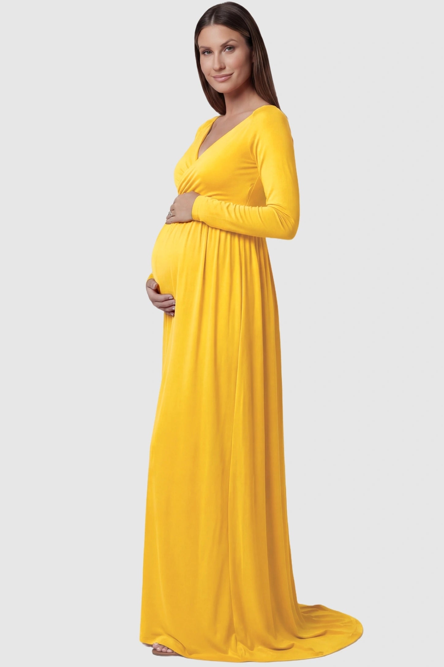 Off-Shoulder Long Sleeve Trailing Maxi Maternity Dress Off-shoulder long sleeve trailing maxi maternity dress in mustard yellow featuring elegant long sleeve silhouette in side view on a pregnant model