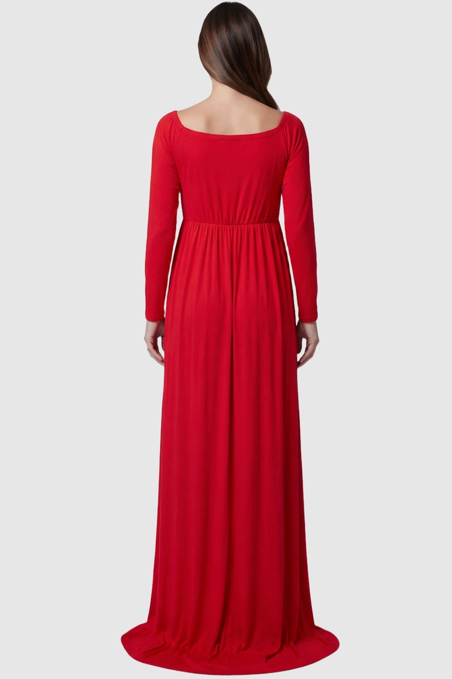 Off-Shoulder Long Sleeve Trailing Maxi Maternity Dress Off-shoulder long sleeve trailing maxi maternity dress in red featuring flowing extended train in back view on a pregnant model