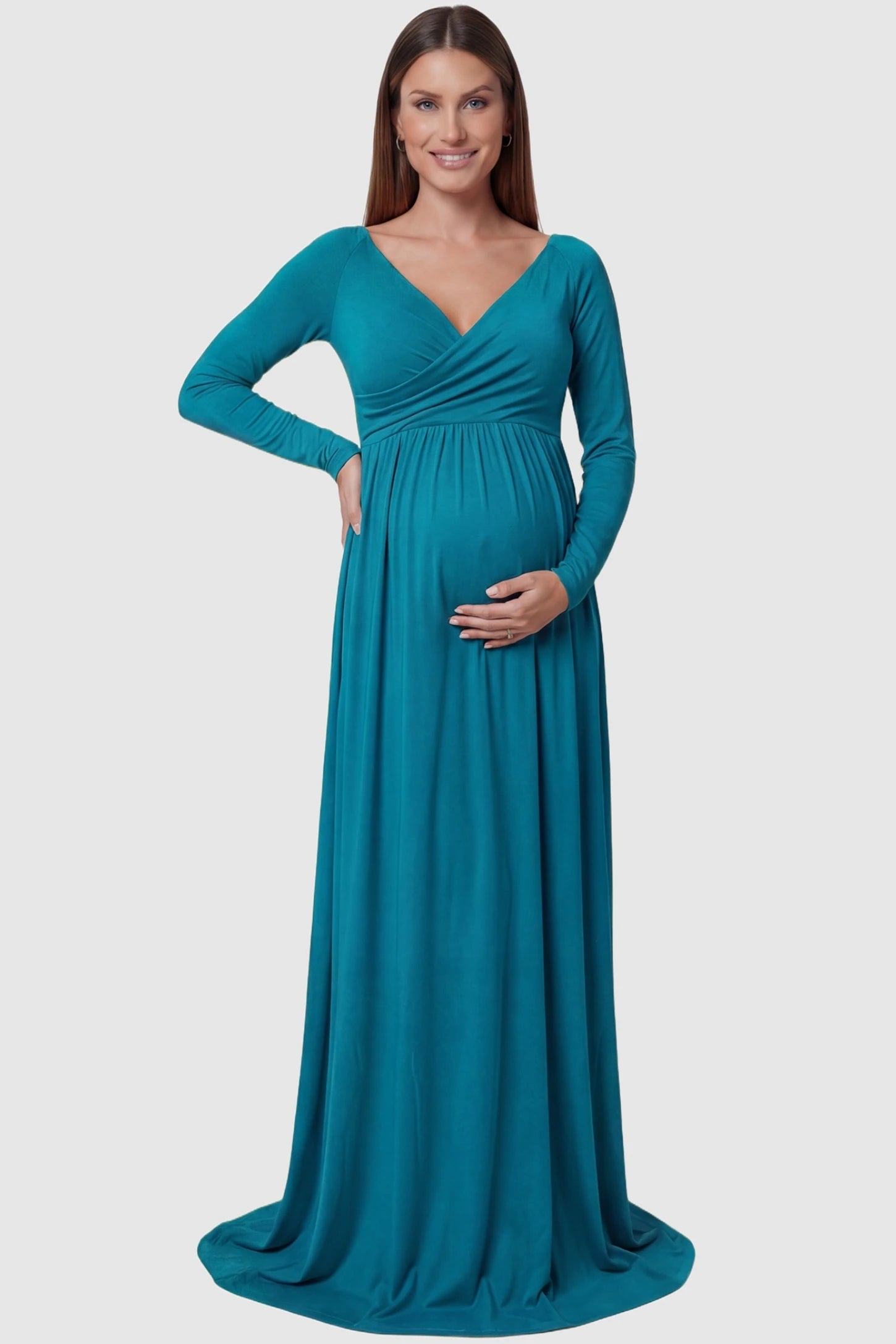Off-Shoulder Long Sleeve Trailing Maxi Maternity Dress Off-shoulder long sleeve trailing maxi maternity dress in turquoise featuring an elegant long sleeve silhouette in front view on a pregnant model
