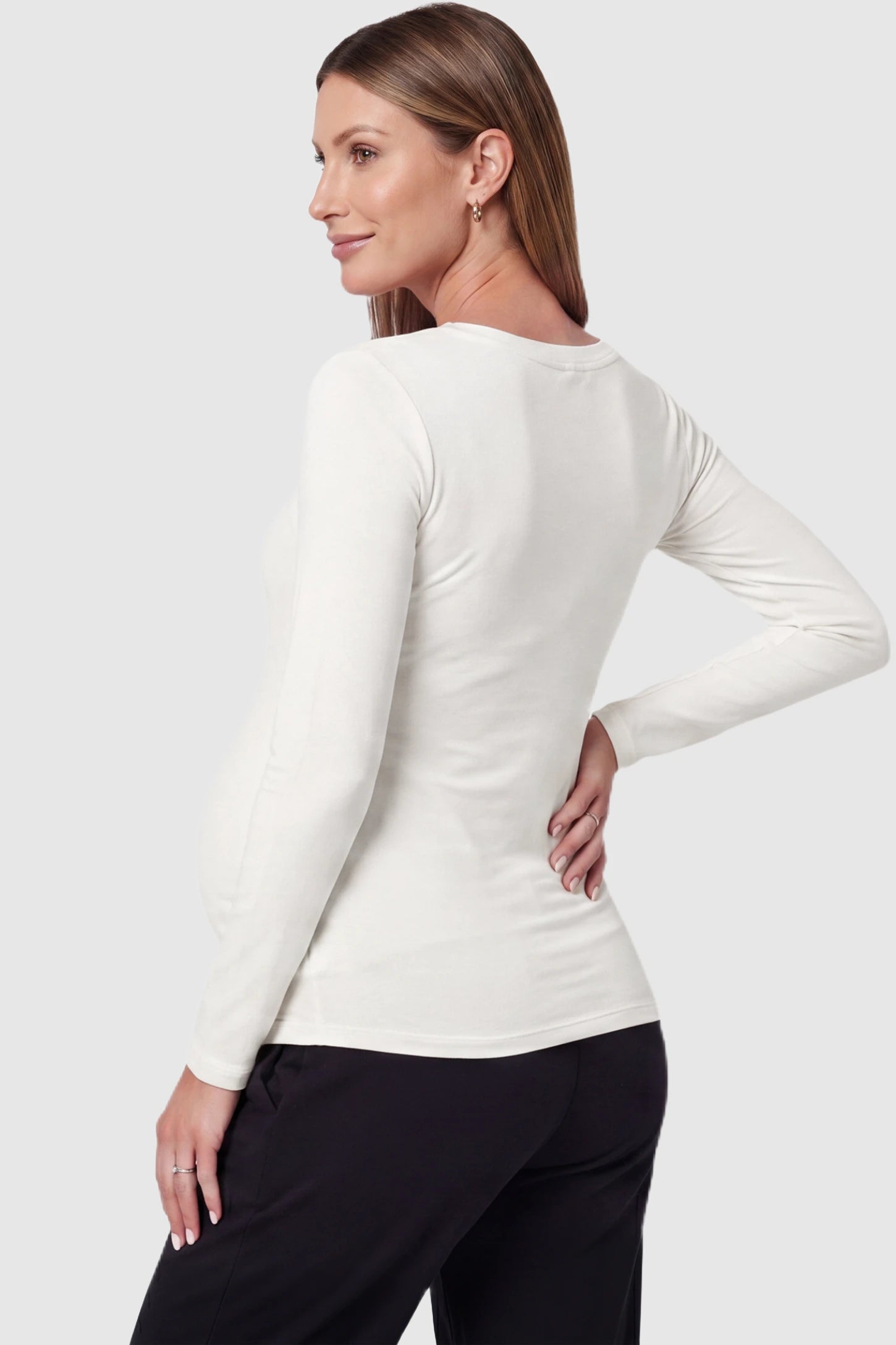 Soft Knit Long Sleeve V-Neck Maternity Top Soft knit long sleeve V-neck maternity top in white with long sleeves, back view on pregnant model