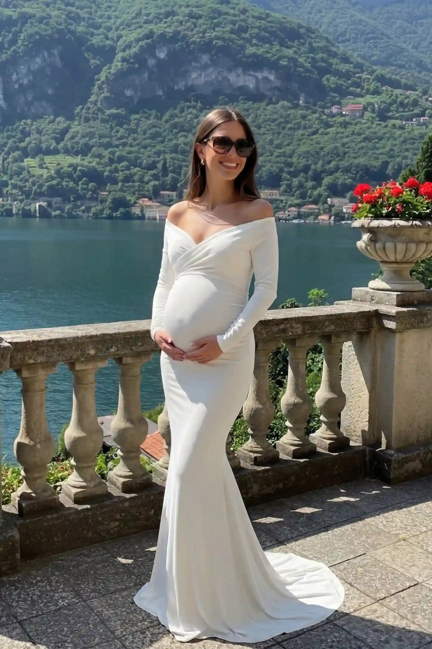 Off-Shoulder Long Sleeve Trailing Maxi Maternity Dress Off-shoulder long sleeve trailing maxi maternity dress in white with glamorous styling, editorial lifestyle model