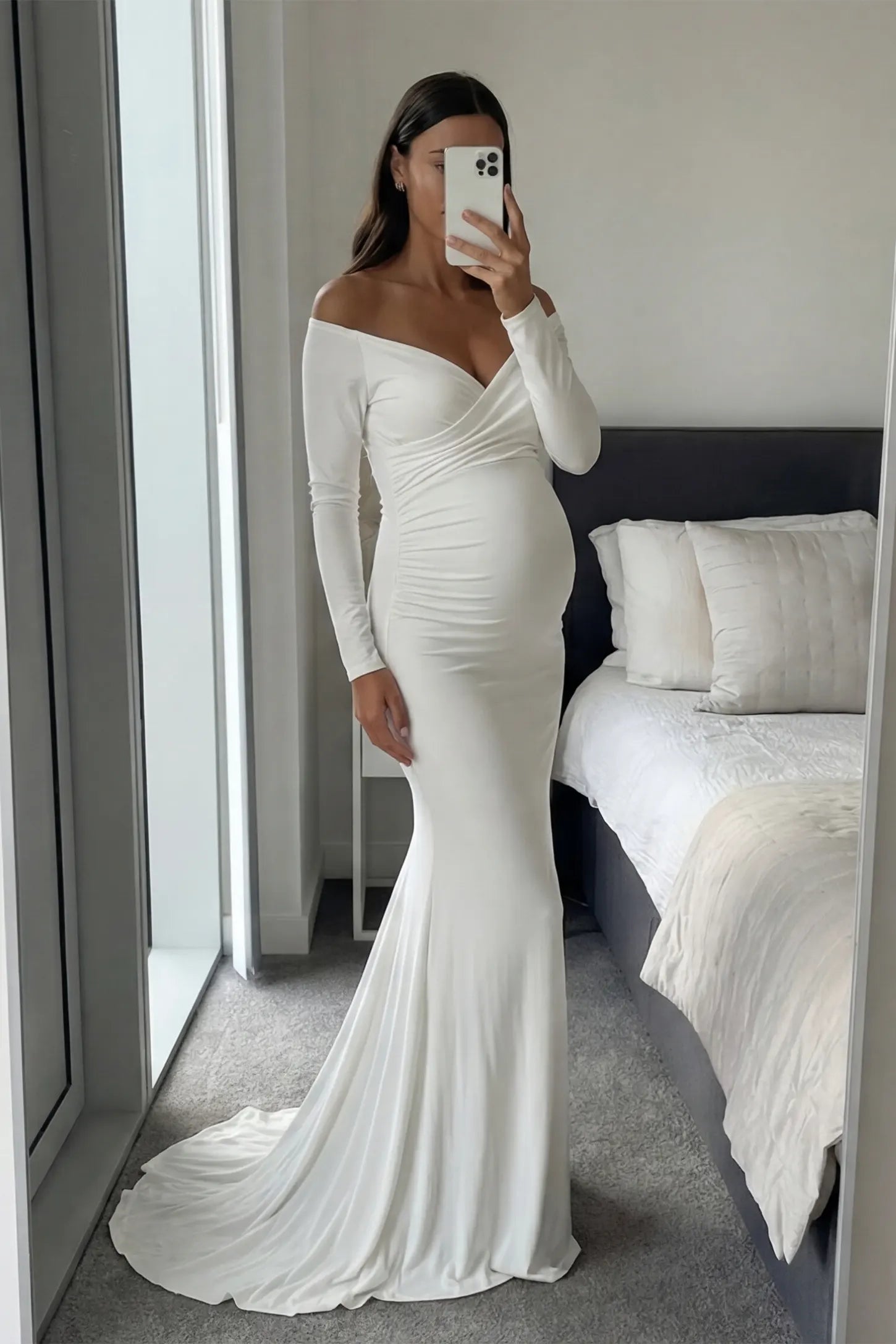 Off-Shoulder Long Sleeve Trailing Maxi Maternity Dress Off-shoulder long sleeve trailing maxi maternity dress in white with elegant silhouette, lifestyle UGC model
