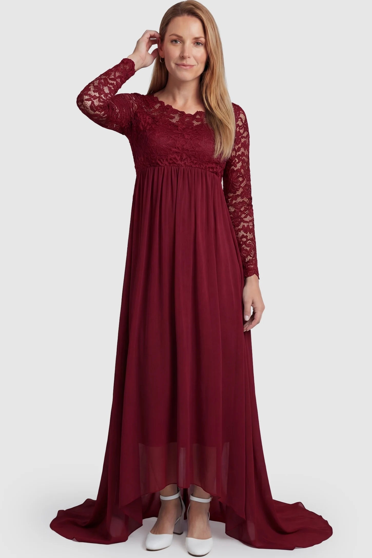 Lace Long Sleeve Full Skirt Maxi Maternity Dress Lace long sleeve full skirt maxi maternity dress in burgundy with elegant long sleeves & lace bodice, front view on postpartum model