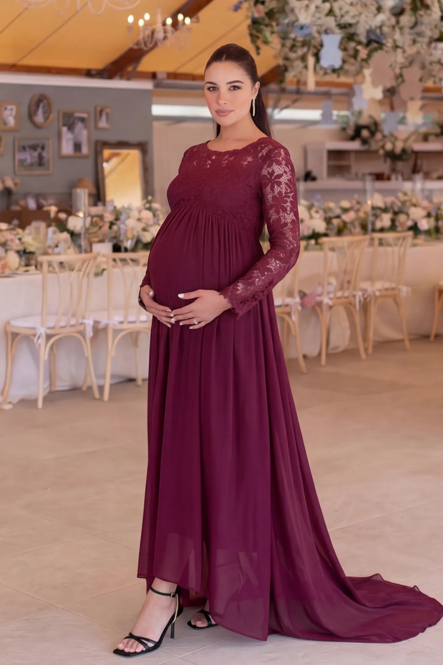 Lace Long Sleeve Full Skirt Maxi Maternity Dress Lace long sleeve full skirt maxi maternity dress in burgundy with elegant long sleeves & lace bodice, front view on pregnant model