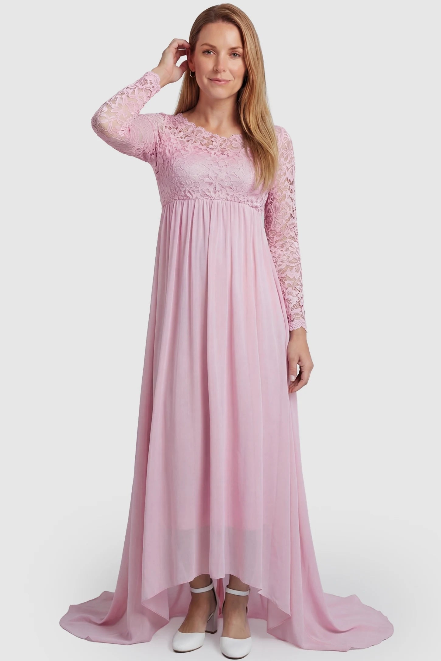 Lace Long Sleeve Full Skirt Maxi Maternity Dress Lace long sleeve full skirt maxi maternity dress in pink with elegant long sleeves & lace bodice, front view on postpartum model