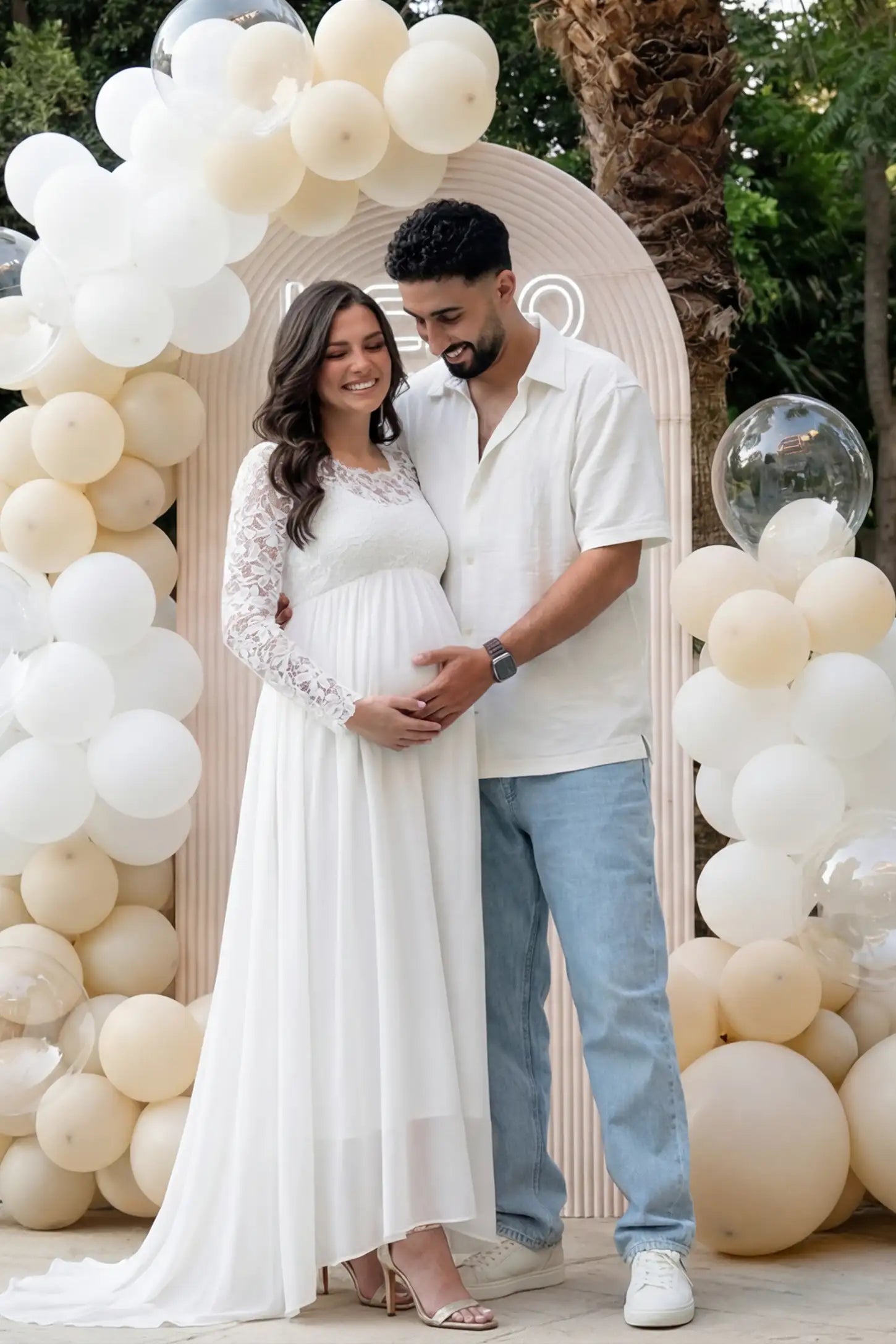 Lace Long Sleeve Full Skirt Maxi Maternity Dress Lace long sleeve full skirt maxi maternity dress in white with elegant long sleeves & lace bodice, front view on pregnant model
