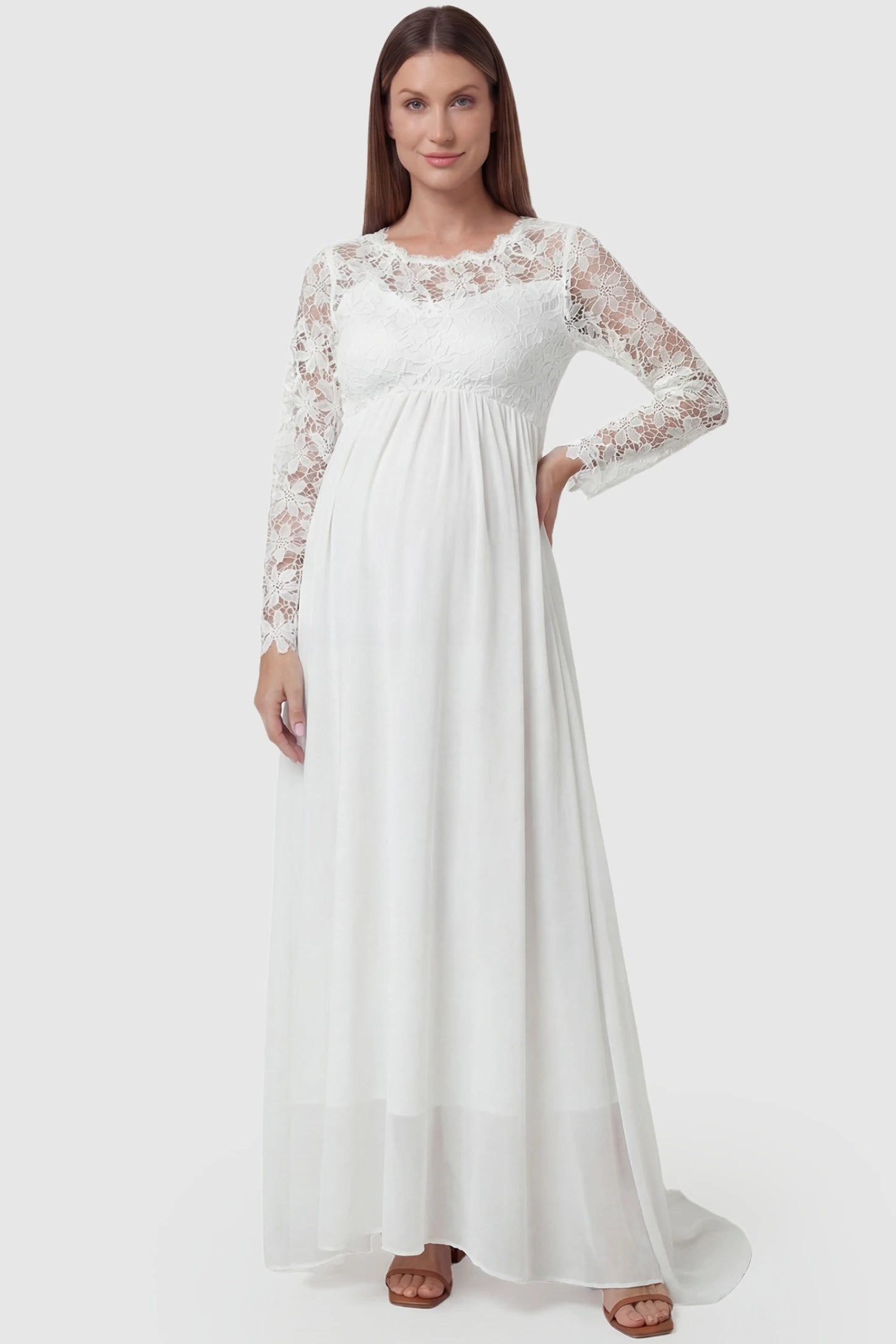 Lace Long Sleeve Full Skirt Maxi Maternity Dress Lace long sleeve full skirt maxi maternity dress in white with elegant long sleeves & lace bodice, front view on pregnant model