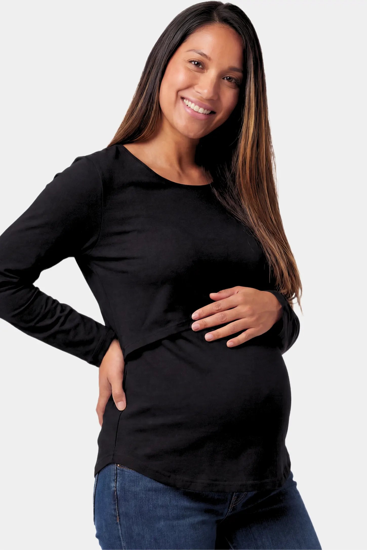 Basic Long Sleeve Maternity & Nursing Top Basic Long Sleeve Maternity & Nursing Top in black featuring a relaxed crew neck and nursing-friendly design on a pregnant model.