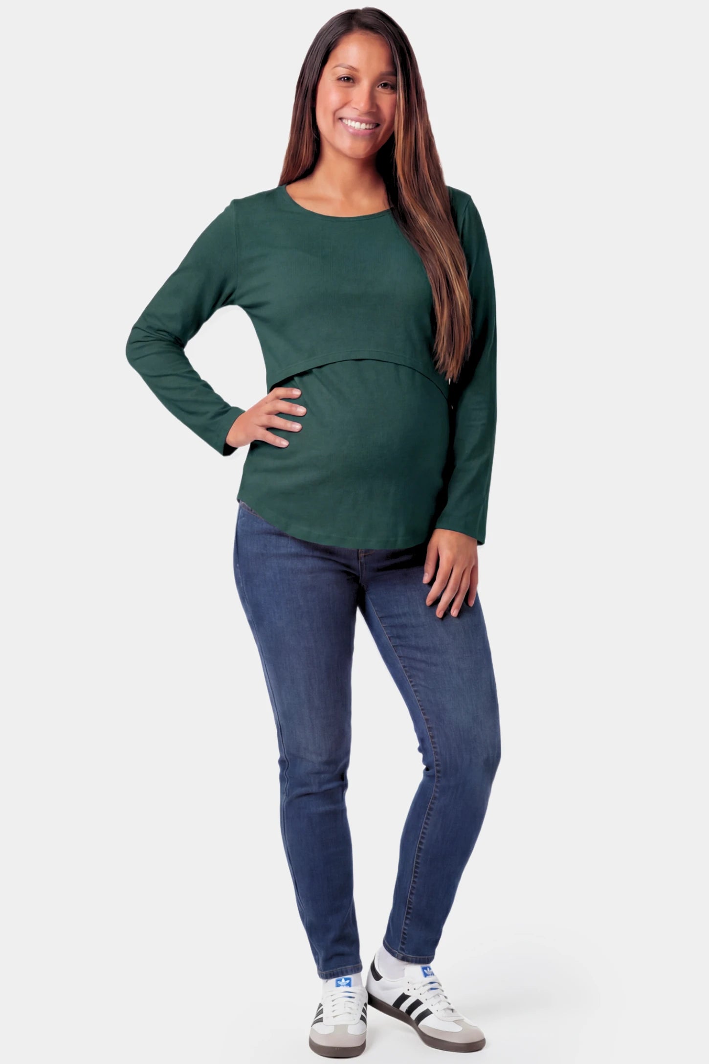 Basic Long Sleeve Maternity & Nursing Top Basic Long Sleeve Maternity & Nursing Top in green featuring a relaxed crew neck and nursing-friendly design on a pregnant model.