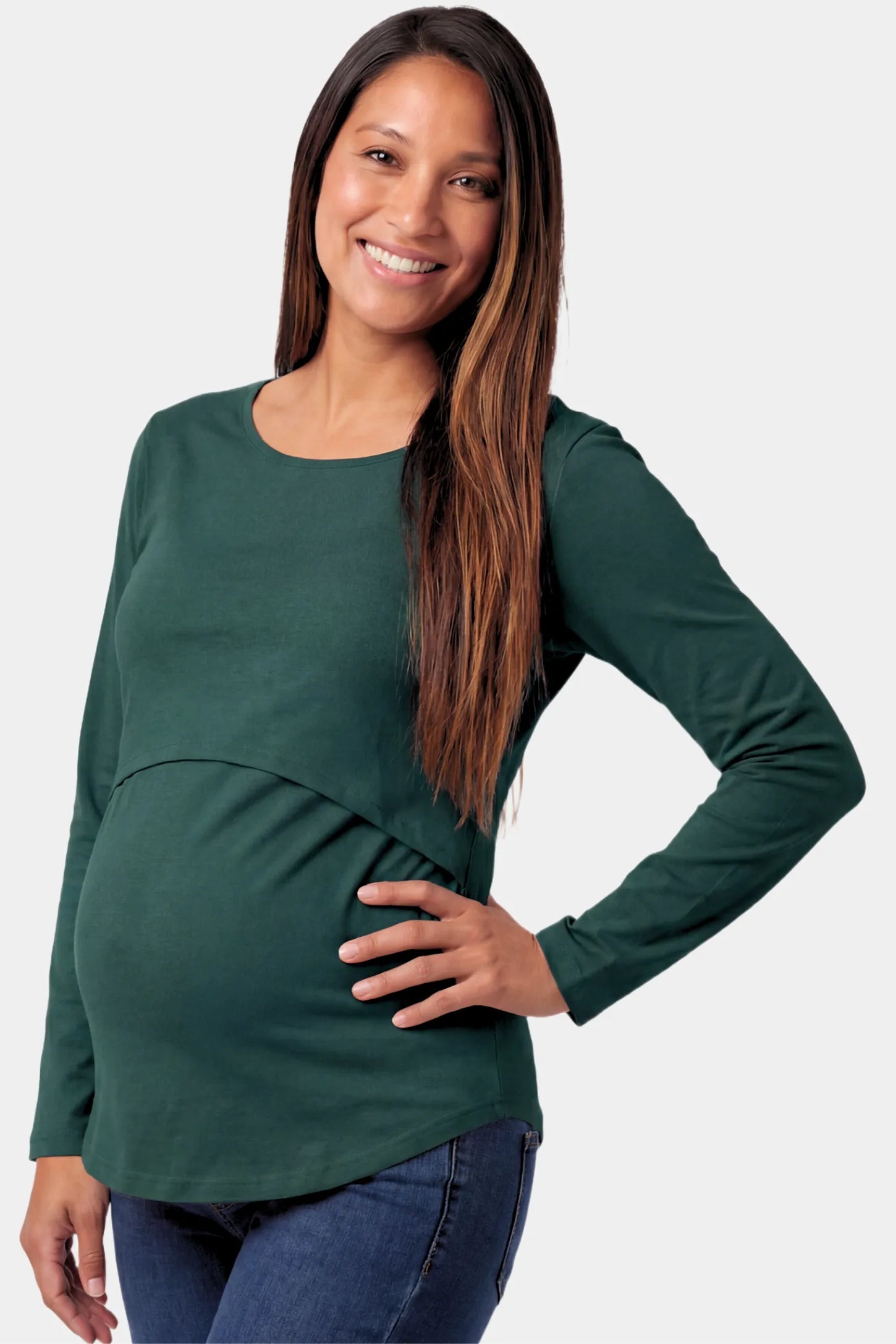 Basic Long Sleeve Maternity & Nursing Top Basic Long Sleeve Maternity & Nursing Top in green featuring a relaxed crew neck and nursing-friendly design on a pregnant model.