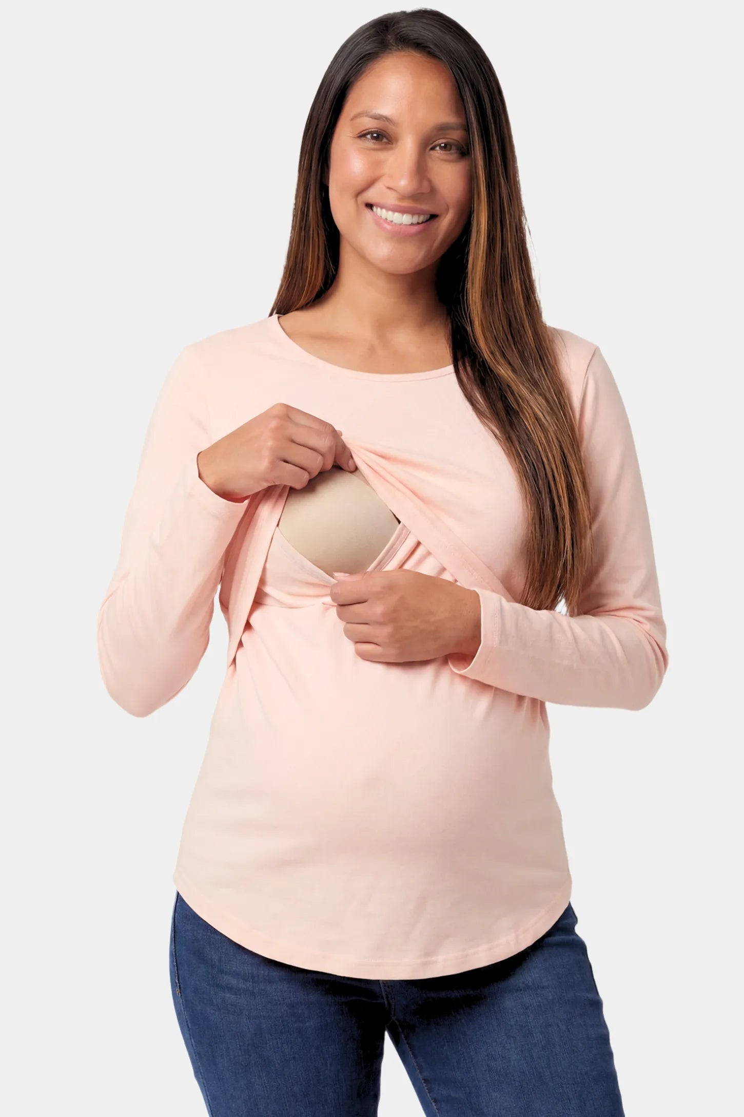 Basic Long Sleeve Maternity & Nursing Top Basic Long Sleeve Maternity & Nursing Top in pink featuring a relaxed crew neck and nursing-friendly design on a pregnant model.