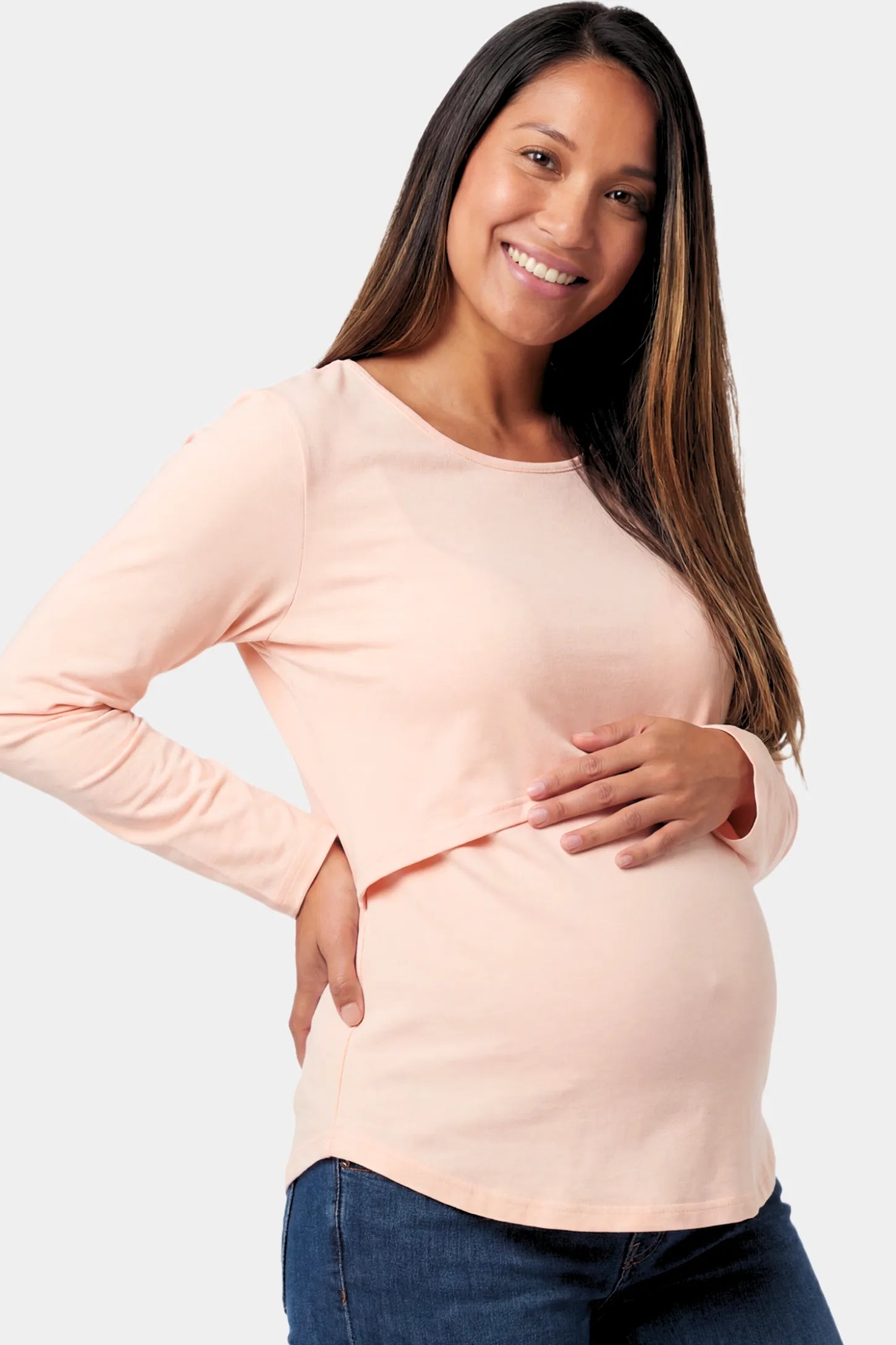 Basic Long Sleeve Maternity & Nursing Top in pink featuring a relaxed crew neck and nursing-friendly design on a pregnant model.