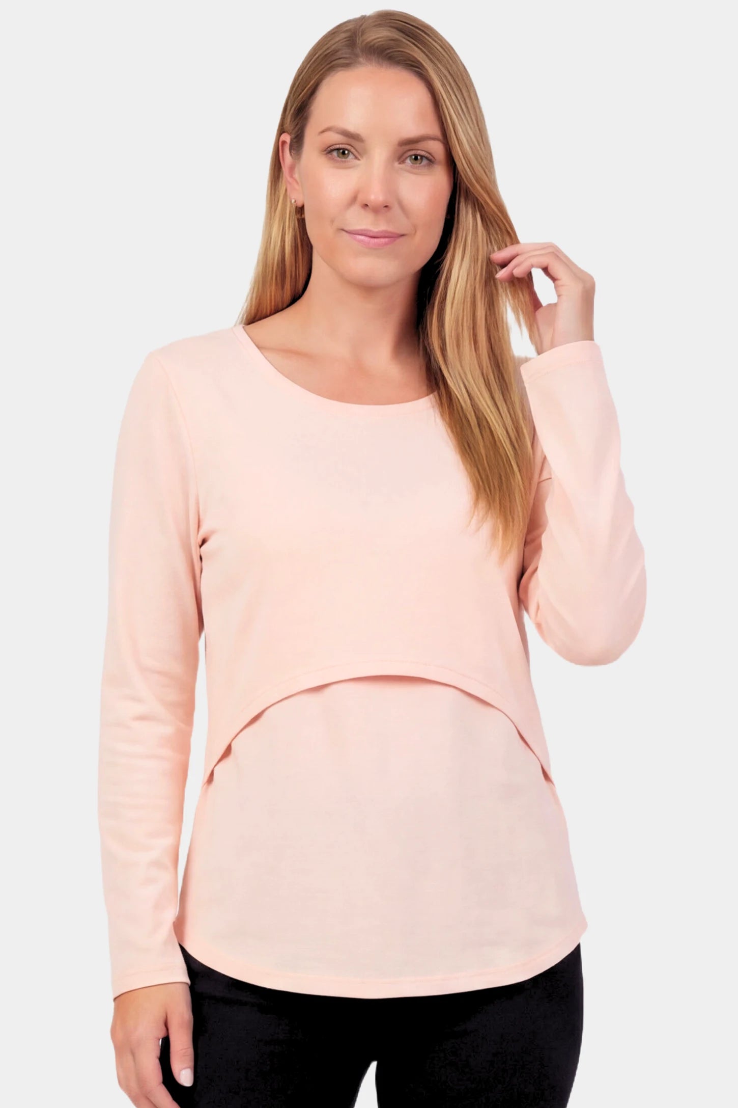 Basic Long Sleeve Maternity & Nursing Top Basic Long Sleeve Maternity & Nursing Top in pink featuring a relaxed crew neck and nursing-friendly design on a non pregnant model.