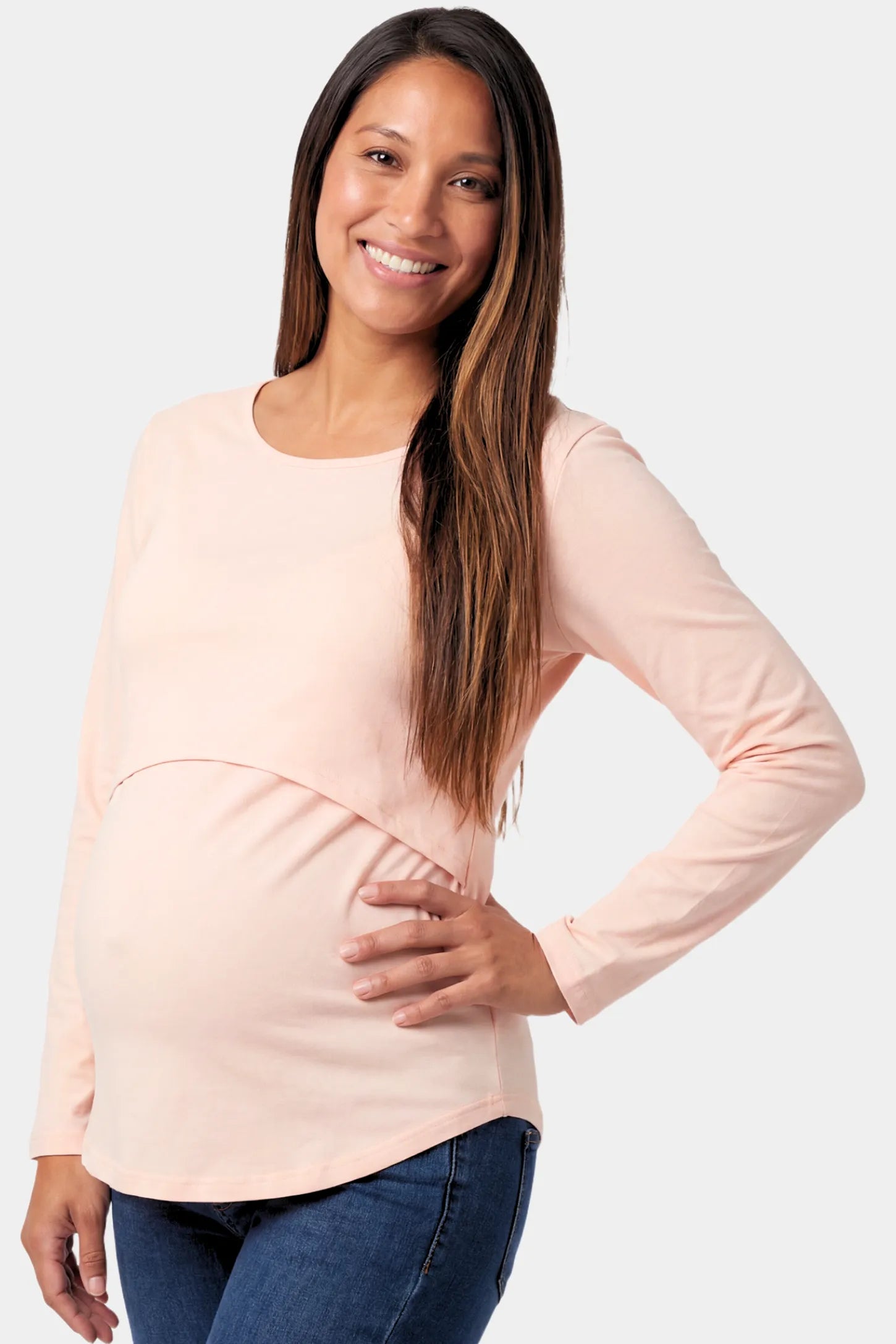 Basic Long Sleeve Maternity & Nursing Top in pink featuring a relaxed crew neck and nursing-friendly design on a pregnant model.