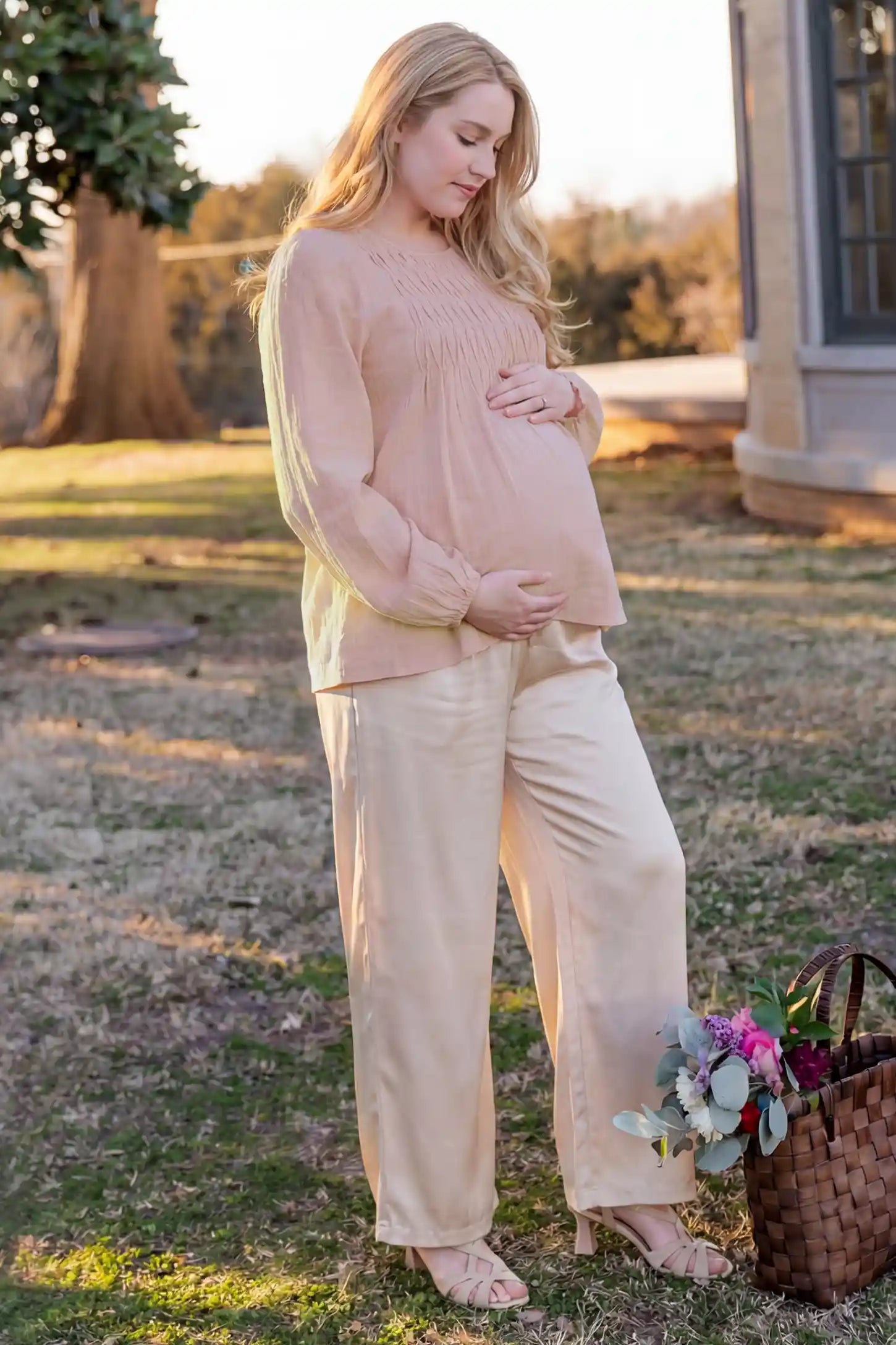 Long Sleeve Round Neck Maternity Blouse Long sleeve round neck maternity blouse in pink with elegant long sleeve, side view on pregnant model