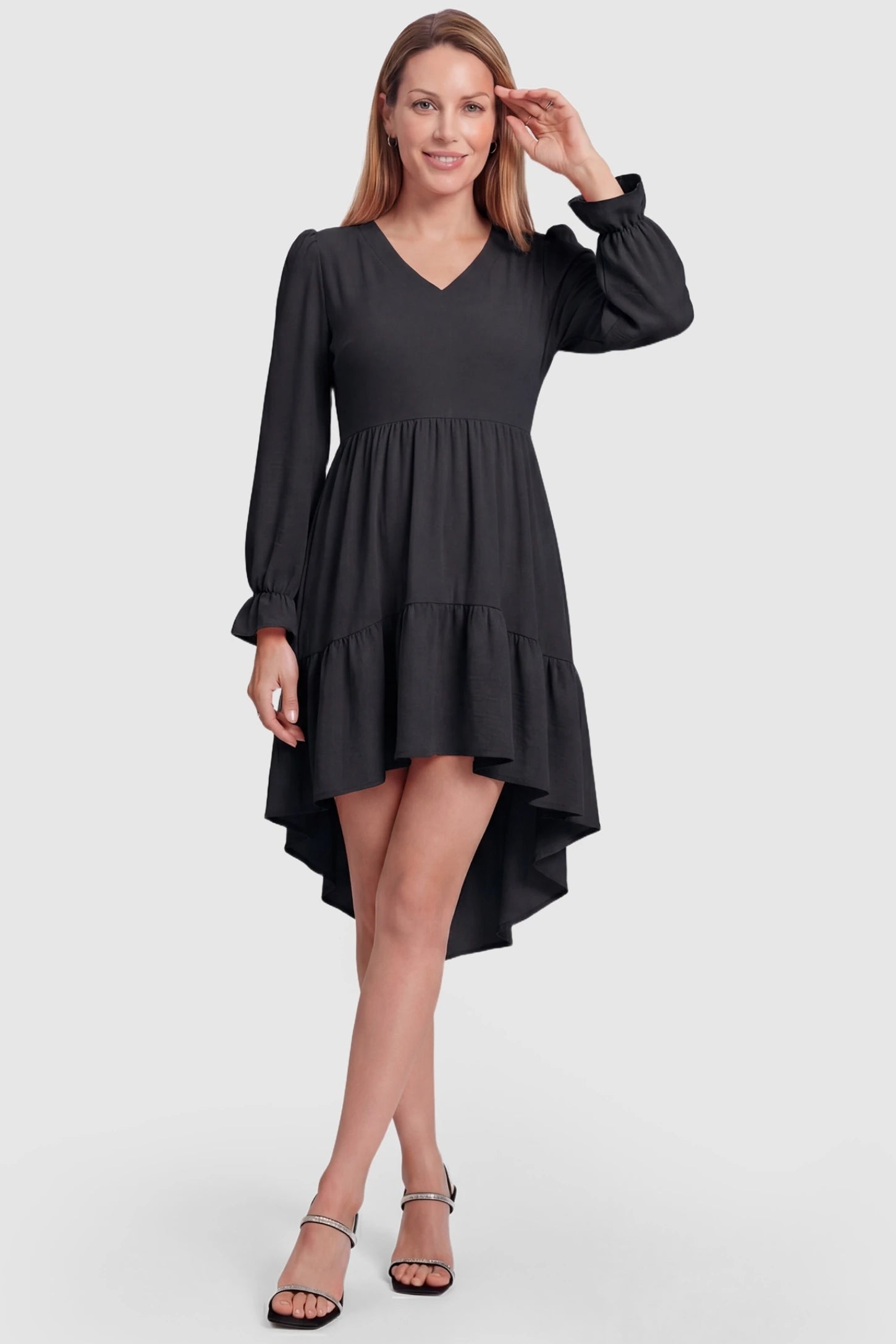 Fishtail Hem Tie-Back Maternity Mini Dress Fishtail Hem Tie-Back Maternity Mini Dress in Black featuring a flowy fit on a non-pregnant model.