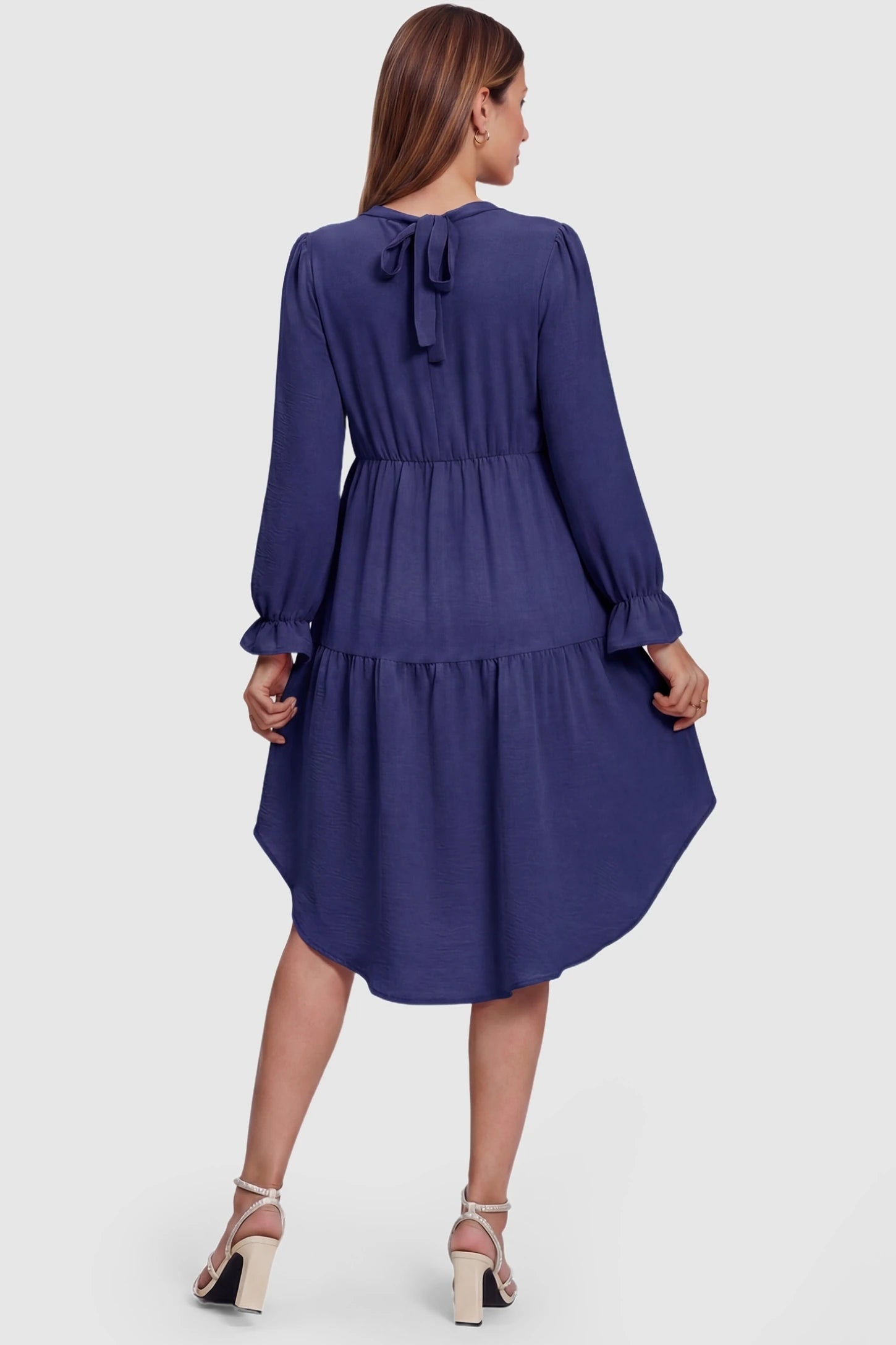 Fishtail Hem Tie-Back Maternity Mini Dress Fishtail Hem Tie-Back Maternity Mini Dress in Navy Blue featuring a functional tie-back on a pregnant model.