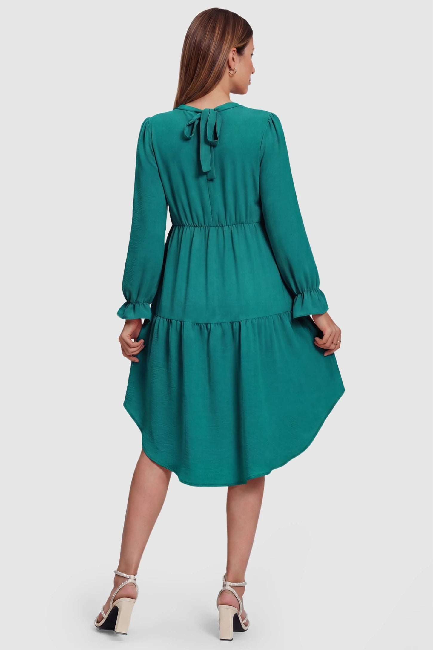 Fishtail Hem Tie-Back Maternity Mini Dress Fishtail Hem Tie-Back Maternity Mini Dress in Green featuring elegant tie-back detailing on a pregnant model.