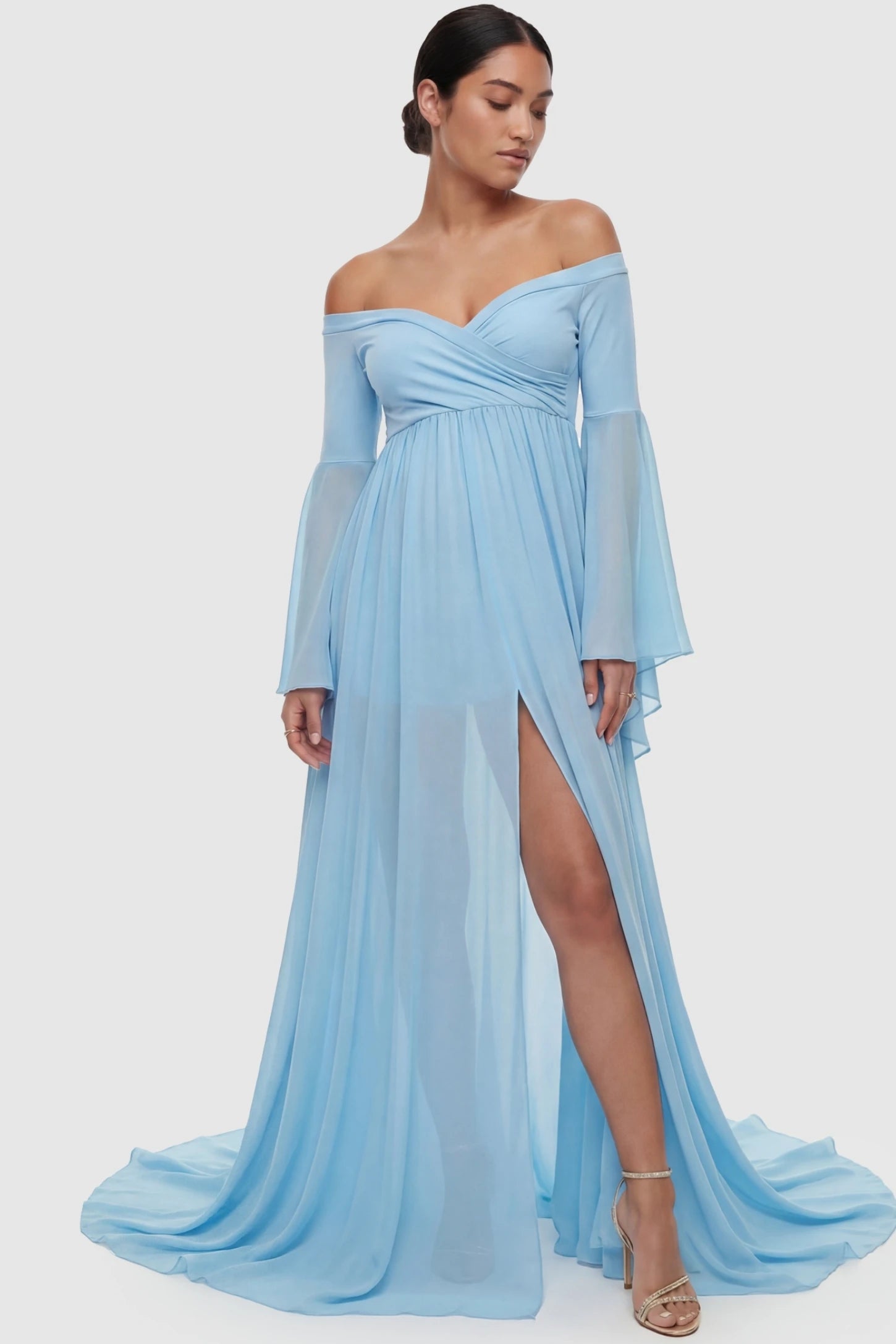 Off-the-Shoulder Long Train Maxi Maternity Dress Off-the-shoulder long train maxi maternity dress in light blue featuring off-shoulder & front-slit in full body front view on a postpartum model